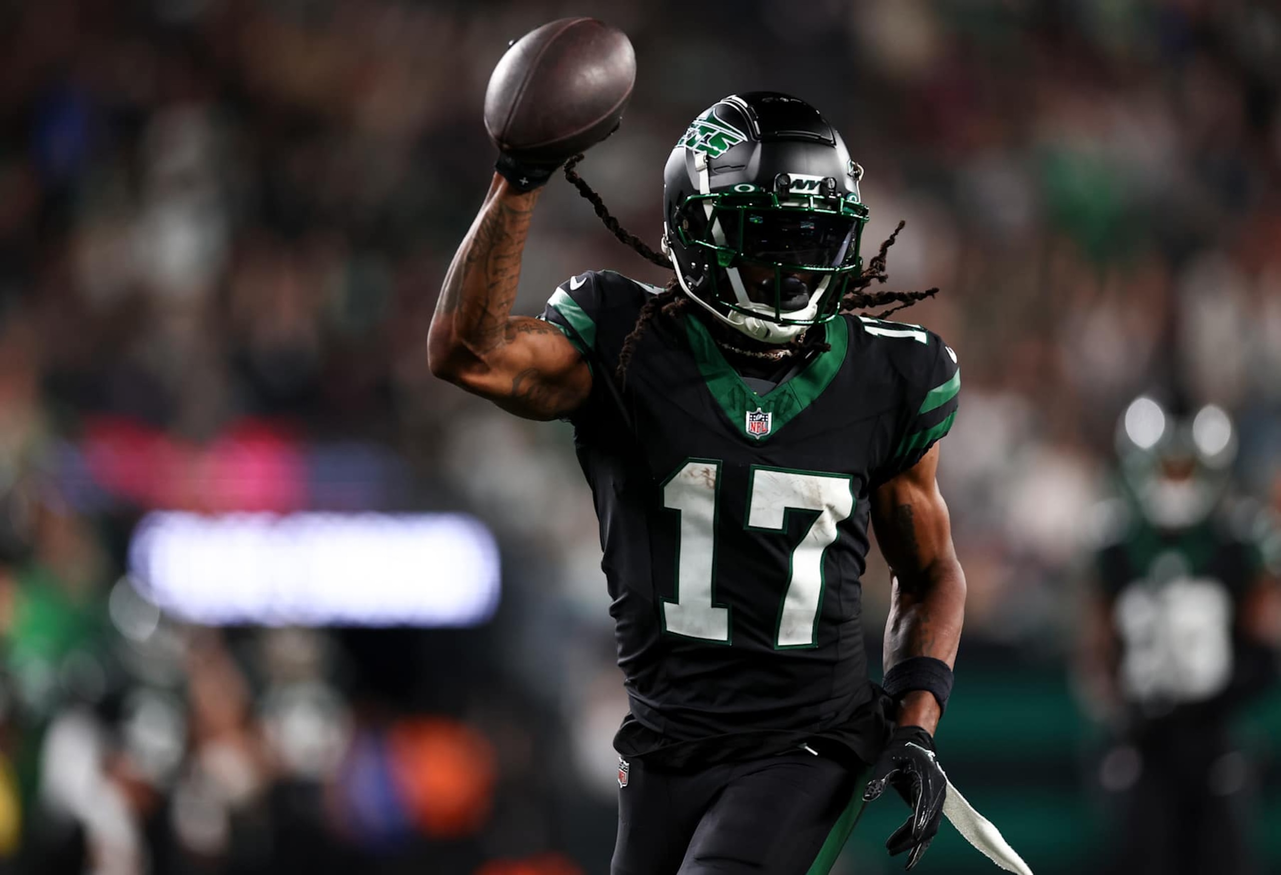 EAST RUTHERFORD, NEW JERSEY - OCTOBER 31: Davante Adams #17 of the New York Jets carries the ball to score a touchdown during the second half of an NFL football game against the Houston Texans, at MetLife Stadium on October 31, 2024 in East Rutherford, New Jersey. (Photo by Kevin Sabitus/Getty Images)