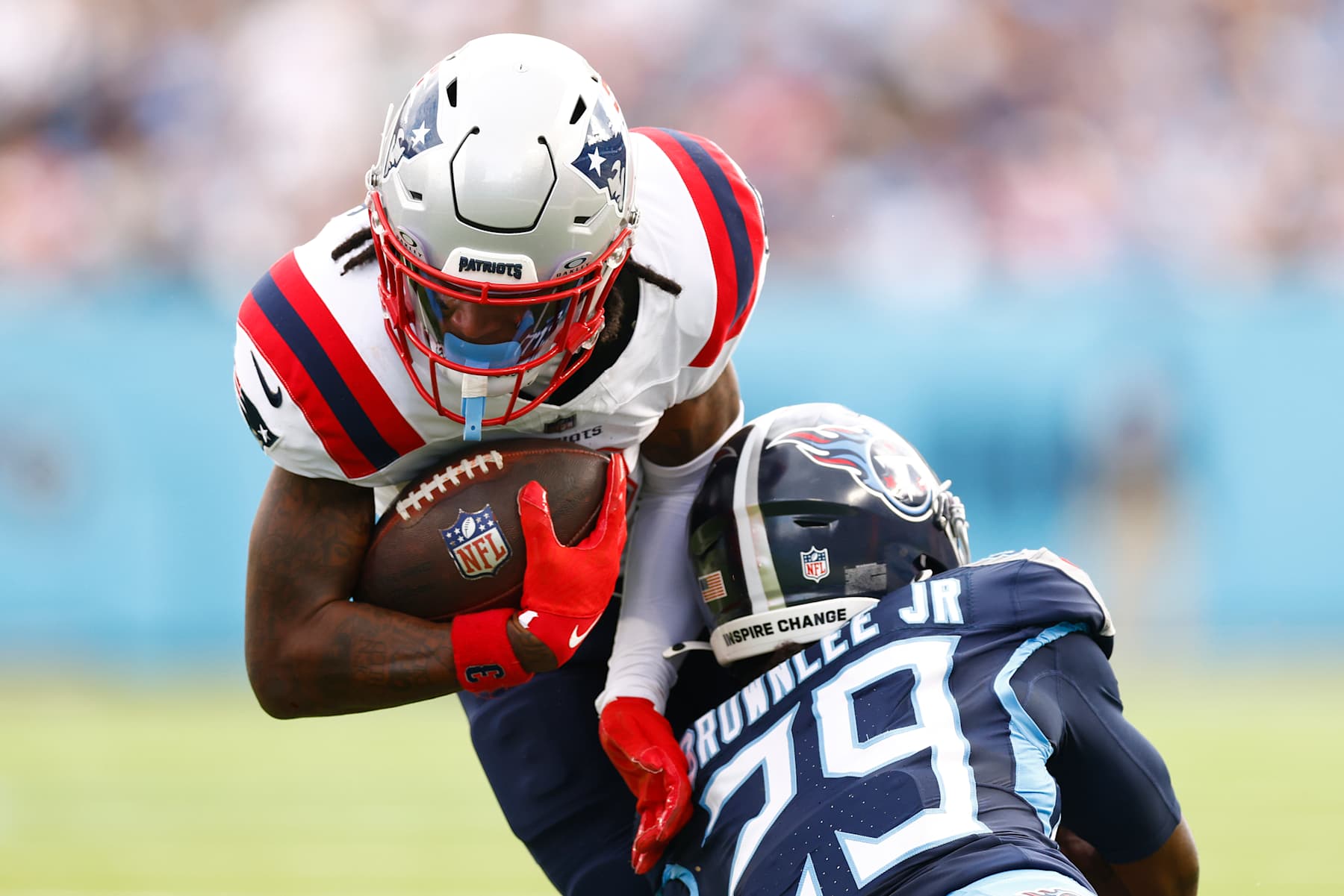 NASHVILLE, TENNESSEE - NOVEMBER 03: Jarvis Brownlee Jr. #29 of the Tennessee Titans tackles DeMario Douglas #3 of the New England Patriots during the third quarter at Nissan Stadium on November 03, 2024 in Nashville, Tennessee. (Photo by Johnnie Izquierdo/Getty Images)