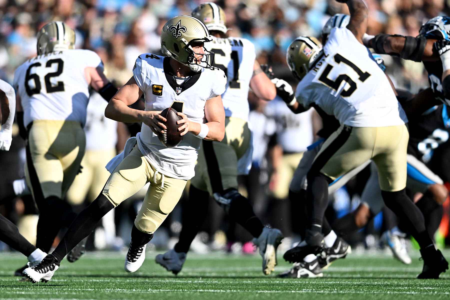 CHARLOTTE, NORTH CAROLINA - NOVEMBER 03: Derek Carr #4 of the New Orleans Saints scrambles during the third quarter against the Carolina Panthers at Bank of America Stadium on November 03, 2024 in Charlotte, North Carolina. (Photo by Matt Kelley/Getty Images)