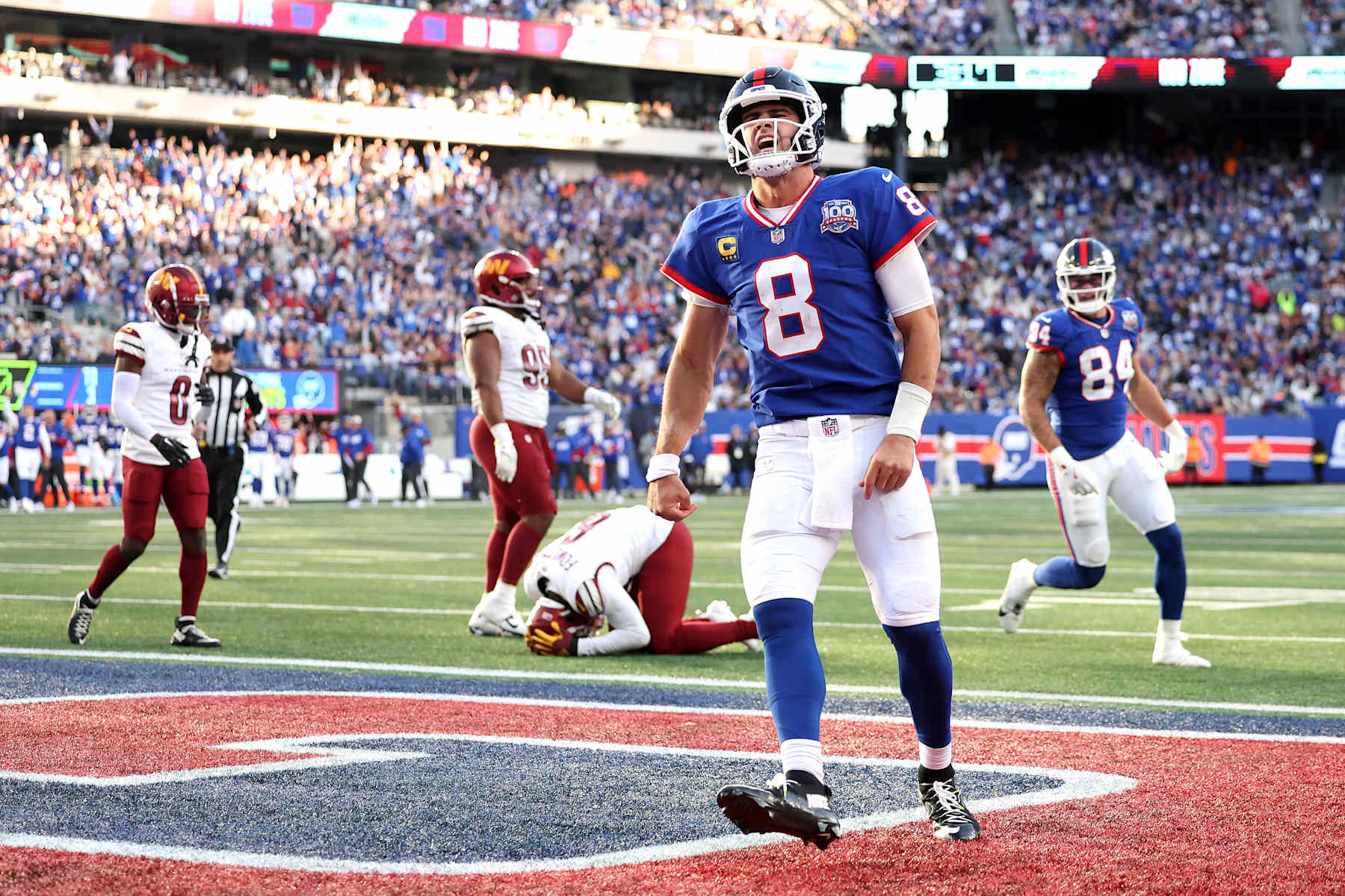 EAST RUTHERFORD, NEW JERSEY - NOVEMBER 03: Daniel Jones #8 of the New York Giants celebrates a touchdown during the fourth quarter against the Washington Commanders at MetLife Stadium on November 03, 2024 in East Rutherford, New Jersey. (Photo by Luke Hales/Getty Images)