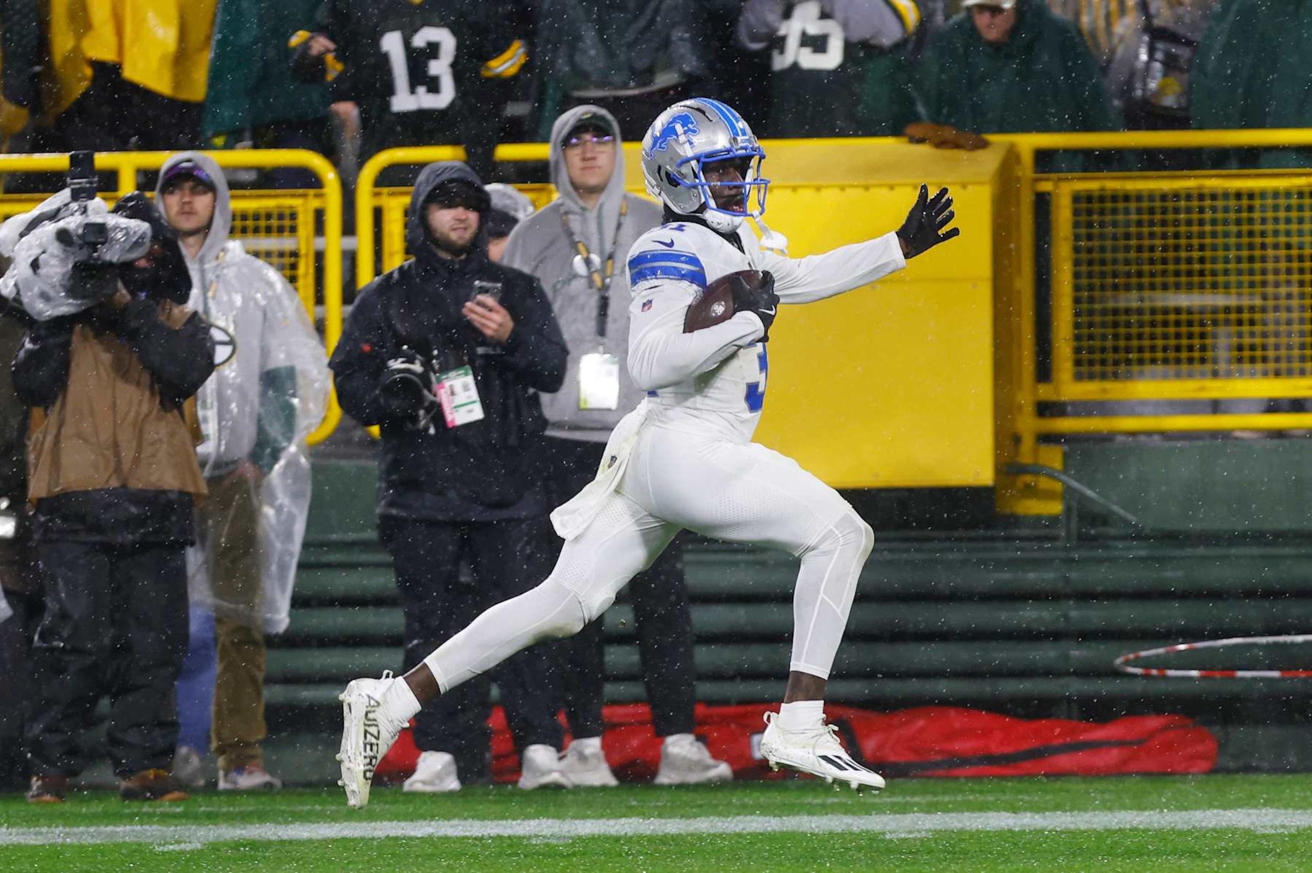 GREEN BAY, WI - NOVEMBER 03: Detroit Lions safety Kerby Joseph (31) returns an interception for a touchdown during a game between the Green Bay Packers and the Detroit Lions at Lambeau Field on November 03, 2024 in Green Bay, WI. (Photo by Larry Radloff/Icon Sportswire via Getty Images)