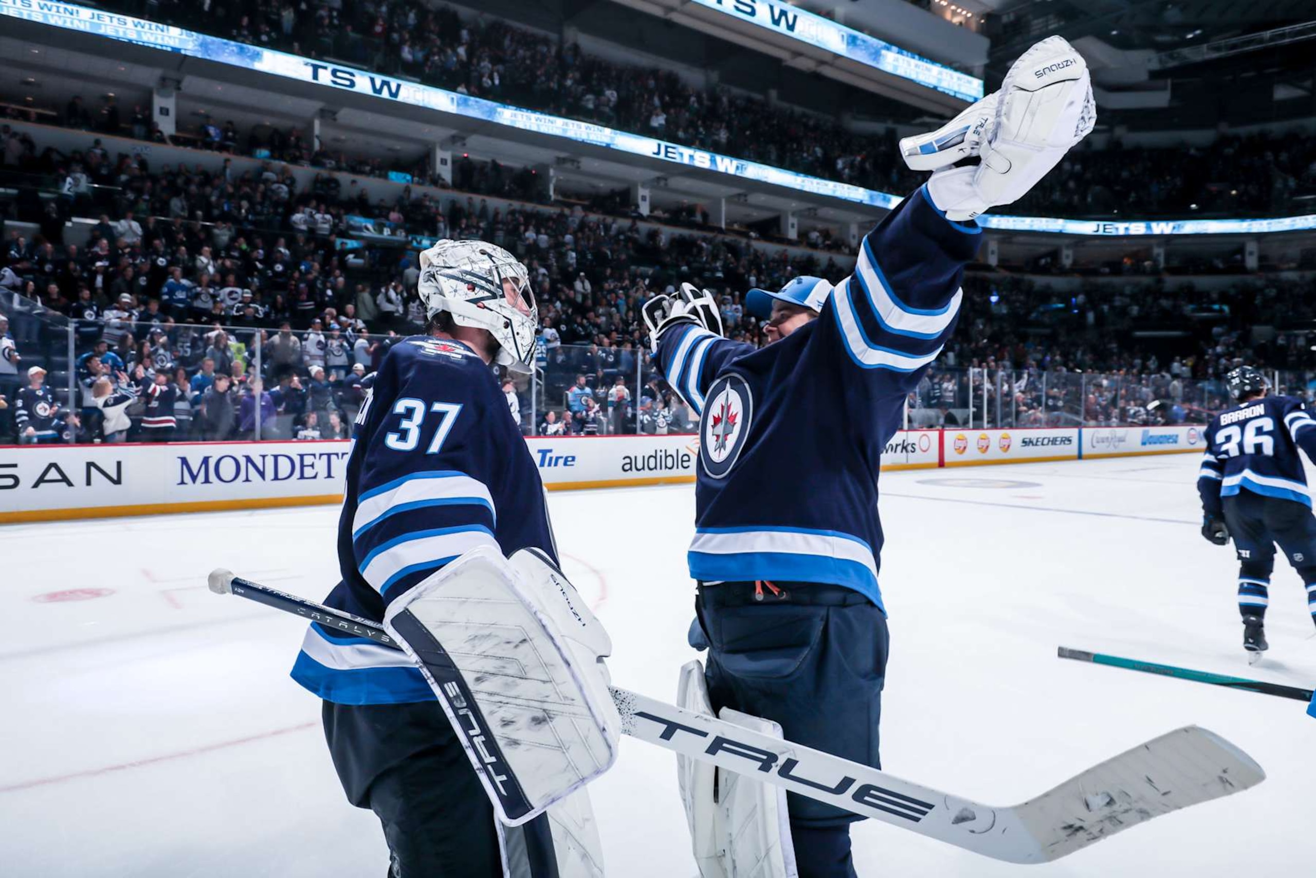 Connor Hellebuyck and Eric Comrie