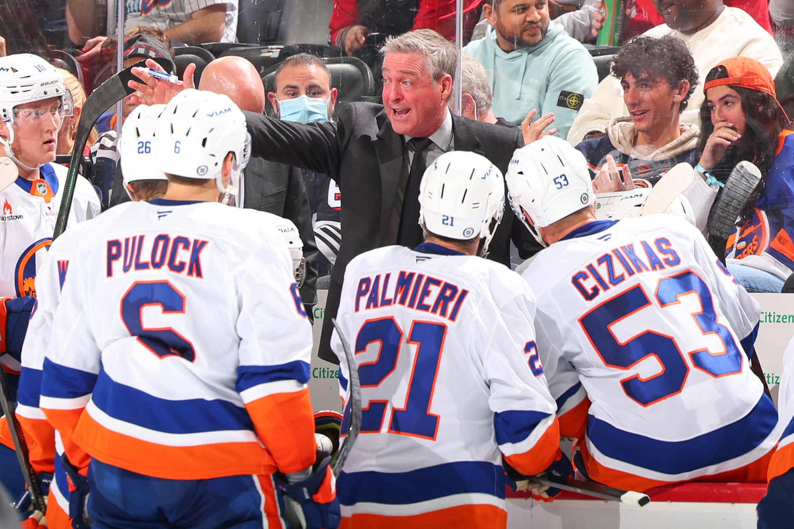 NEWARK, NJ - OCTOBER 25:  Patrick Roy of the New York Islanders behind the bench during the game against the New Jersey Devils at the Prudential Center on October 25, 2024 in Newark, New Jersey.  (Photo by Rich Graessle/NHLI via Getty Images)