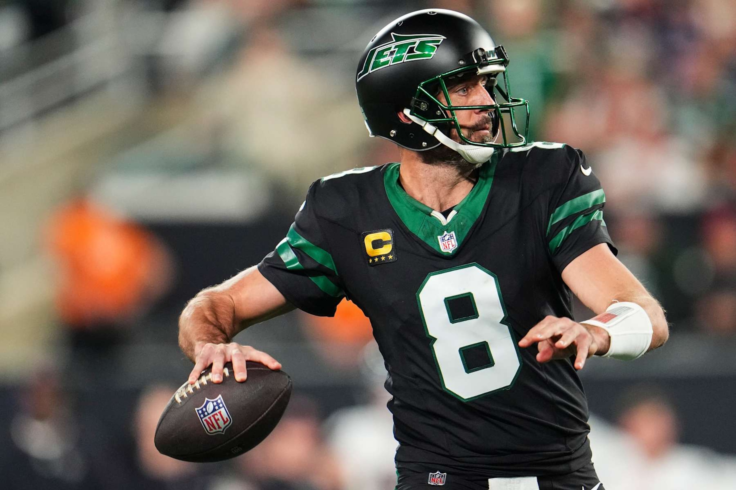 EAST RUTHERFORD, NJ - OCTOBER 31: Aaron Rodgers #8 of the New York Jets drops back to pass during an NFL football game against the Houston Texans at MetLife Stadium on October 31, 2024 in East Rutherford, New Jersey. (Photo by Cooper Neill/Getty Images)