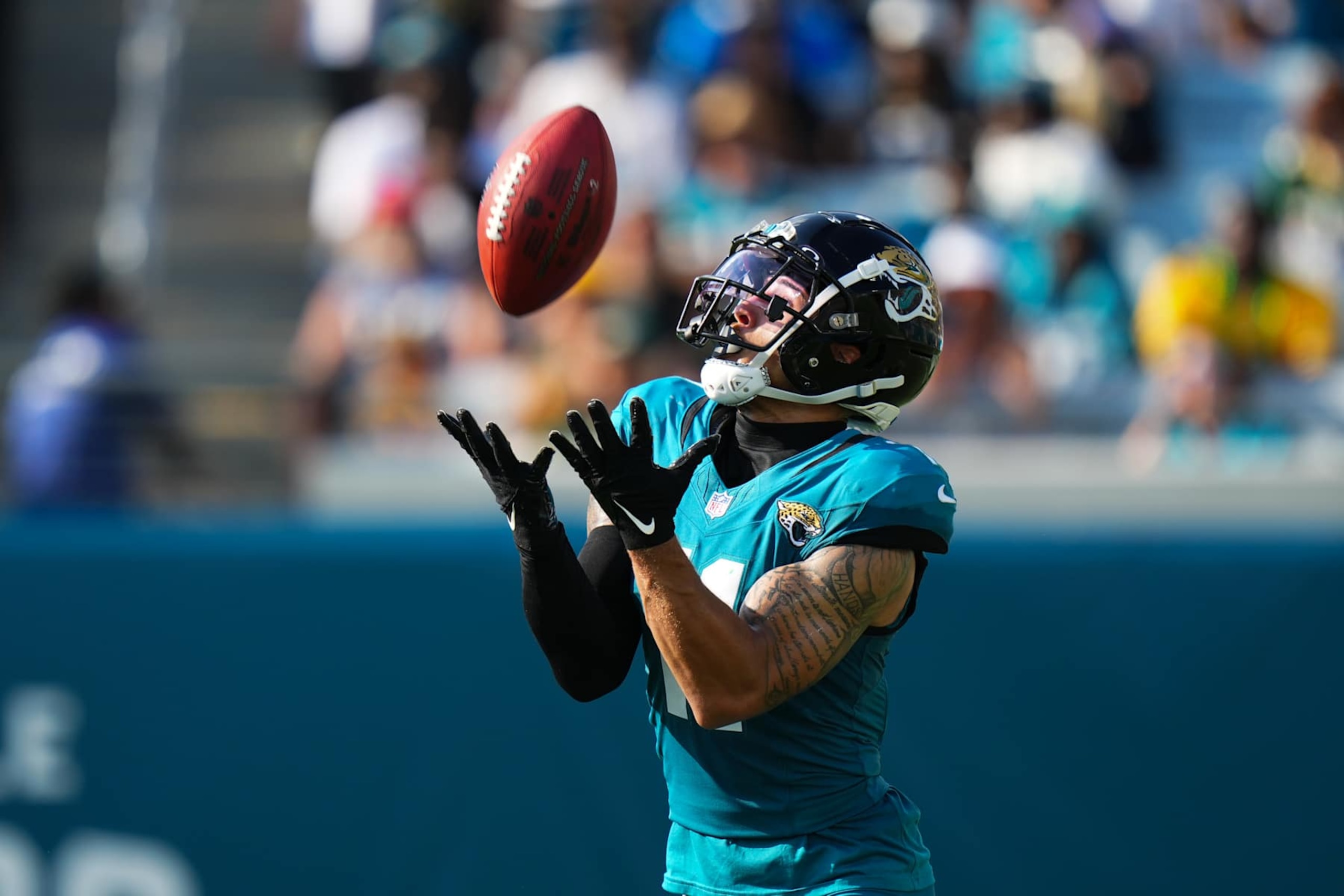 JACKSONVILLE, FLORIDA - OCTOBER 27: Parker Washington #11 of the Jacksonville Jaguars catches a punt during a game against the Green Bay Packers at EverBank Stadium on October 27, 2024 in Jacksonville, Florida. (Photo by Rich Storry/Getty Images)