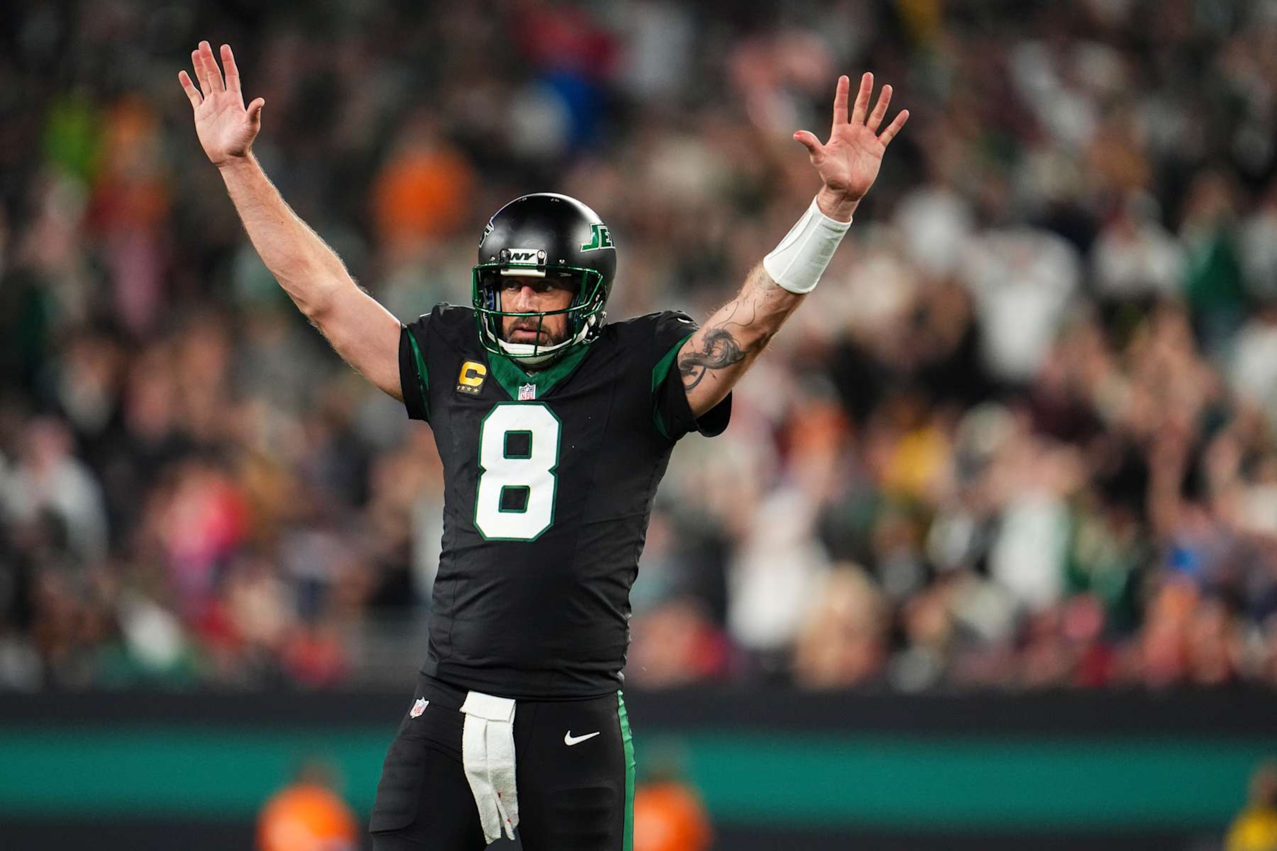 EAST RUTHERFORD, NJ - OCTOBER 31: Aaron Rodgers #8 of the New York Jets celebrates during an NFL football game against the Houston Texans at MetLife Stadium on October 31, 2024 in East Rutherford, New Jersey. (Photo by Cooper Neill/Getty Images)