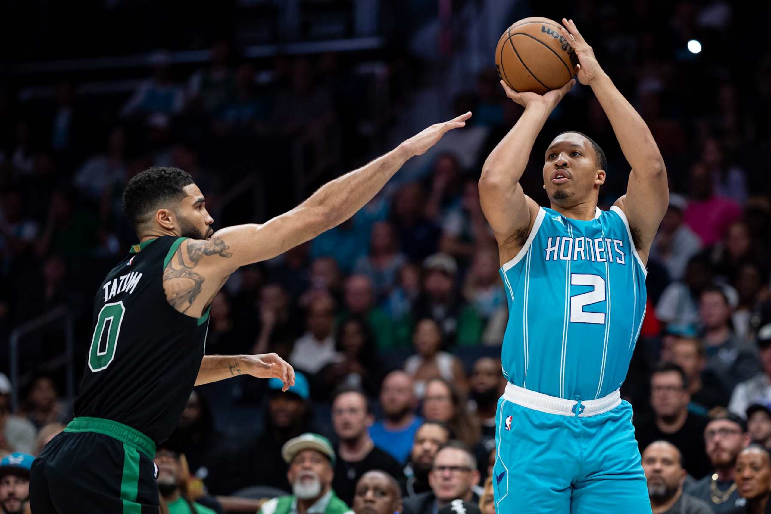 CHARLOTTE, NORTH CAROLINA - NOVEMBER 01: Grant Williams #2 of the Charlotte Hornets shoots the ball while guarded by Jayson Tatum #0 of the Boston Celtics in the first quarter during their game at Spectrum Center on November 01, 2024 in Charlotte, North Carolina. NOTE TO USER: User expressly acknowledges and agrees that, by downloading and or using this photograph, User is consenting to the terms and conditions of the Getty Images License Agreement. (Photo by Jacob Kupferman/Getty Images)