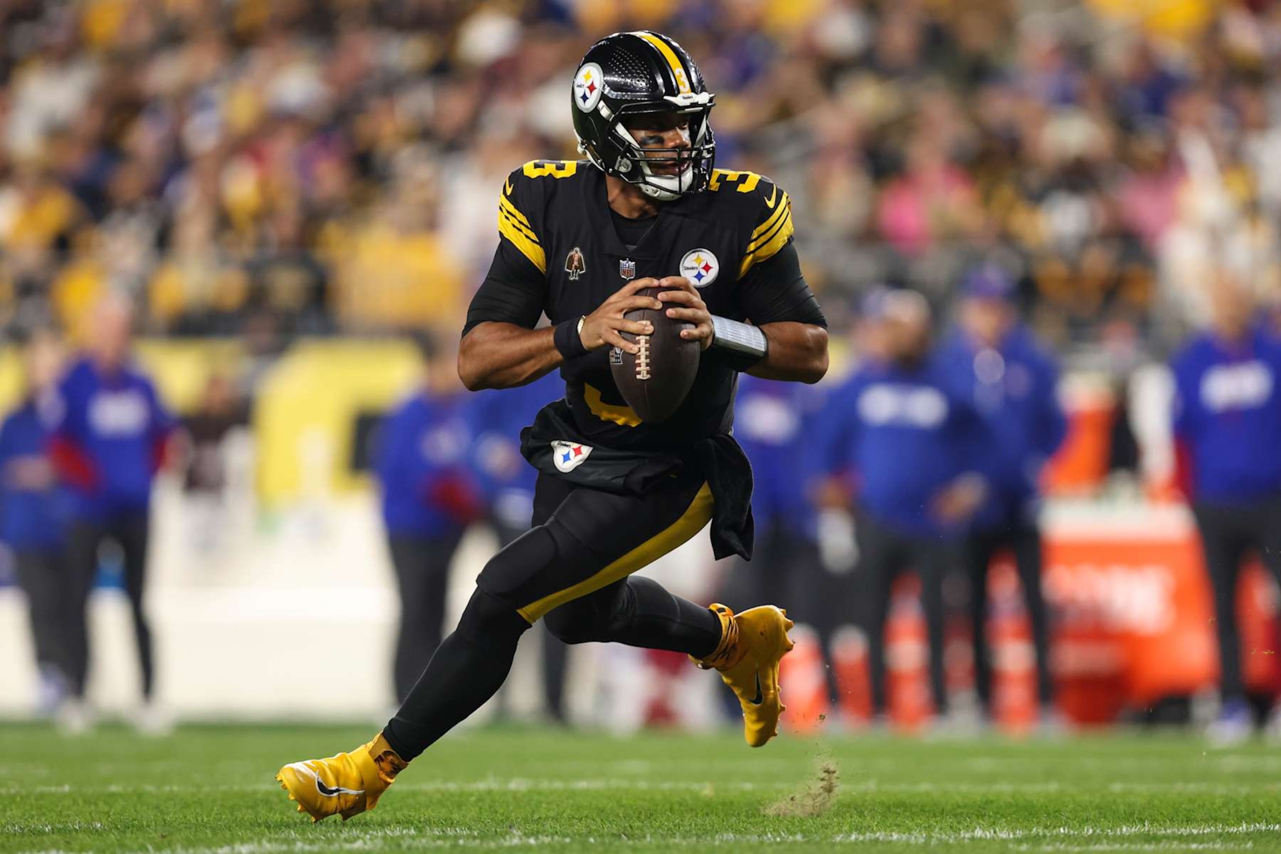 PITTSBURGH, PENNSYLVANIA - OCTOBER 28: Russell Wilson #3 of the Pittsburgh Steelers scrambles out of the pocket during an NFL football game against the New York Giants at Acrisure Stadium on October 28, 2024 in Pittsburgh, Pennsylvania. (Photo by Perry Knotts/Getty Images)