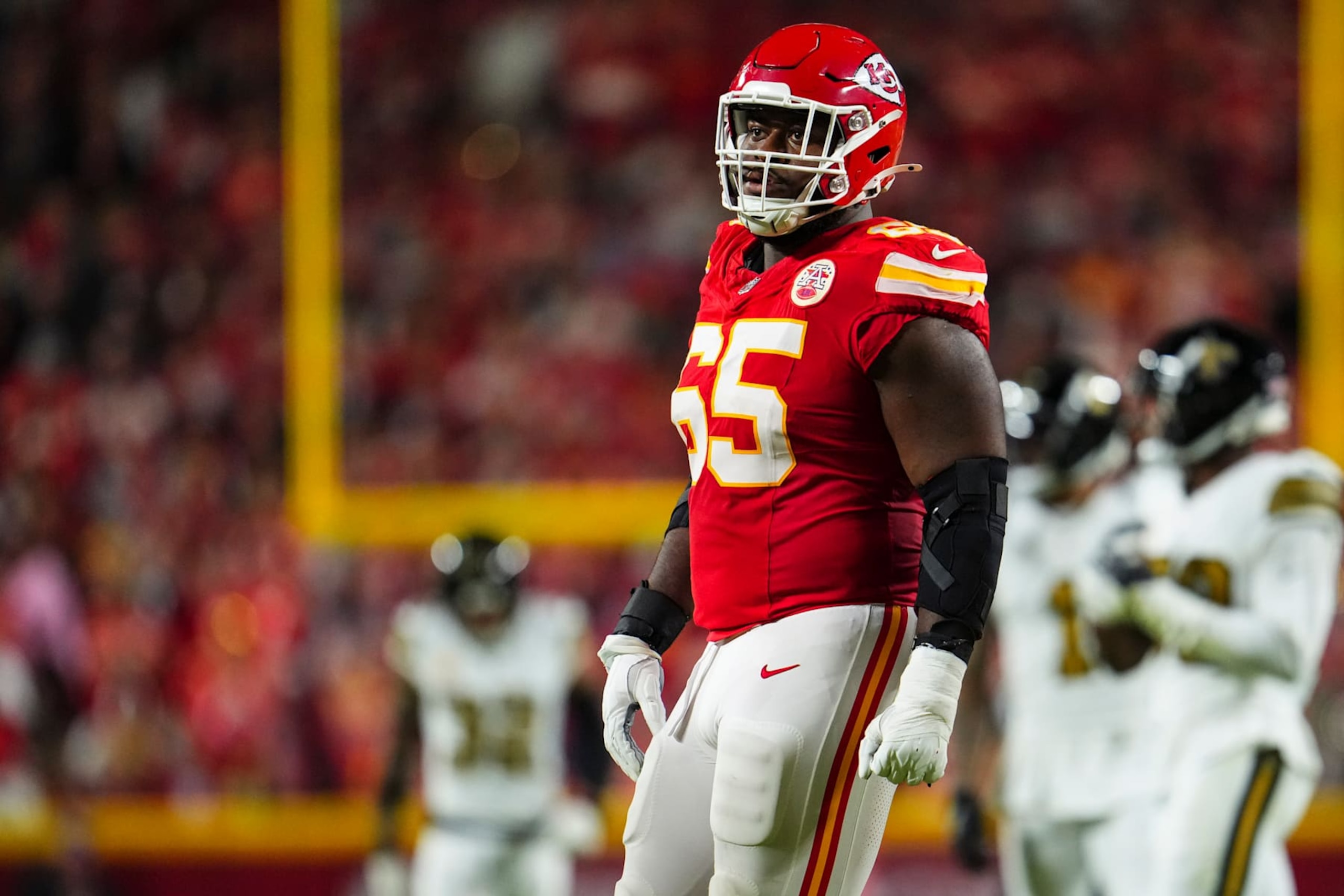 KANSAS CITY, MO - OCTOBER 07: Trey Smith #65 of the Kansas City Chiefs lines up before the snap during an NFL football game against the New Orleans Saints at GEHA Field at Arrowhead Stadium on October 7, 2024 in Kansas City, Missouri. (Photo by Cooper Neill/Getty Images)
