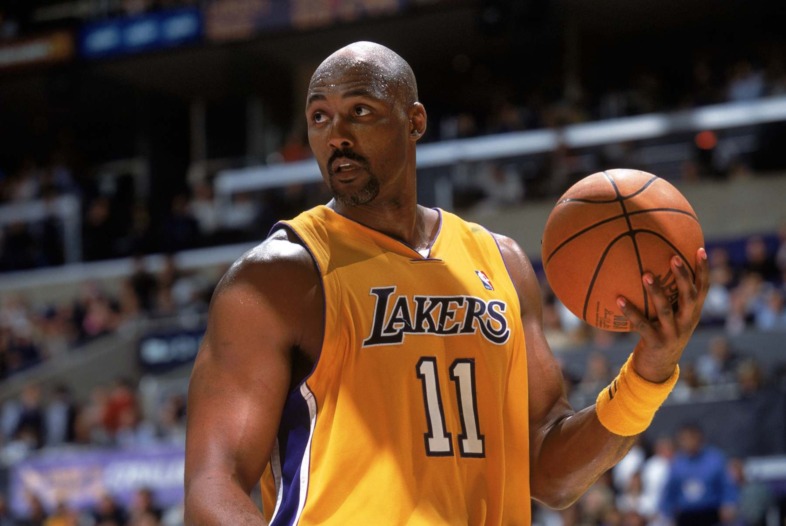 LOS ANGELES - March 15: Karl Malone #11 of the Los Angeles Lakers holds the ball during the game against the Orlando Magic at Staples Center on March 15, 2004 in Los Angeles, California. The Lakers won 113-110. NOTE TO USER: User expressly acknowledges and agrees that, by downloading and/or using this Photograph, User is consenting to the terms and conditions of the Getty Images License Agreement. (Photo by Andrew D. Bernstein/NBAE via Getty Images) LOS ANGELES - March 15: Karl Malone #11 of the Los Angeles Lakers holds the ball during the game against the Orlando Magic at Staples Center on March 15, 2004 in Los Angeles, California. The Lakers won 113-110. NOTE TO USER: User expressly acknowledges and agrees that, by downloading and/or using this Photograph, User is consenting to the terms and conditions of the Getty Images License Agreement. (Photo by Andrew D. Bernstein/NBAE via Getty Images)