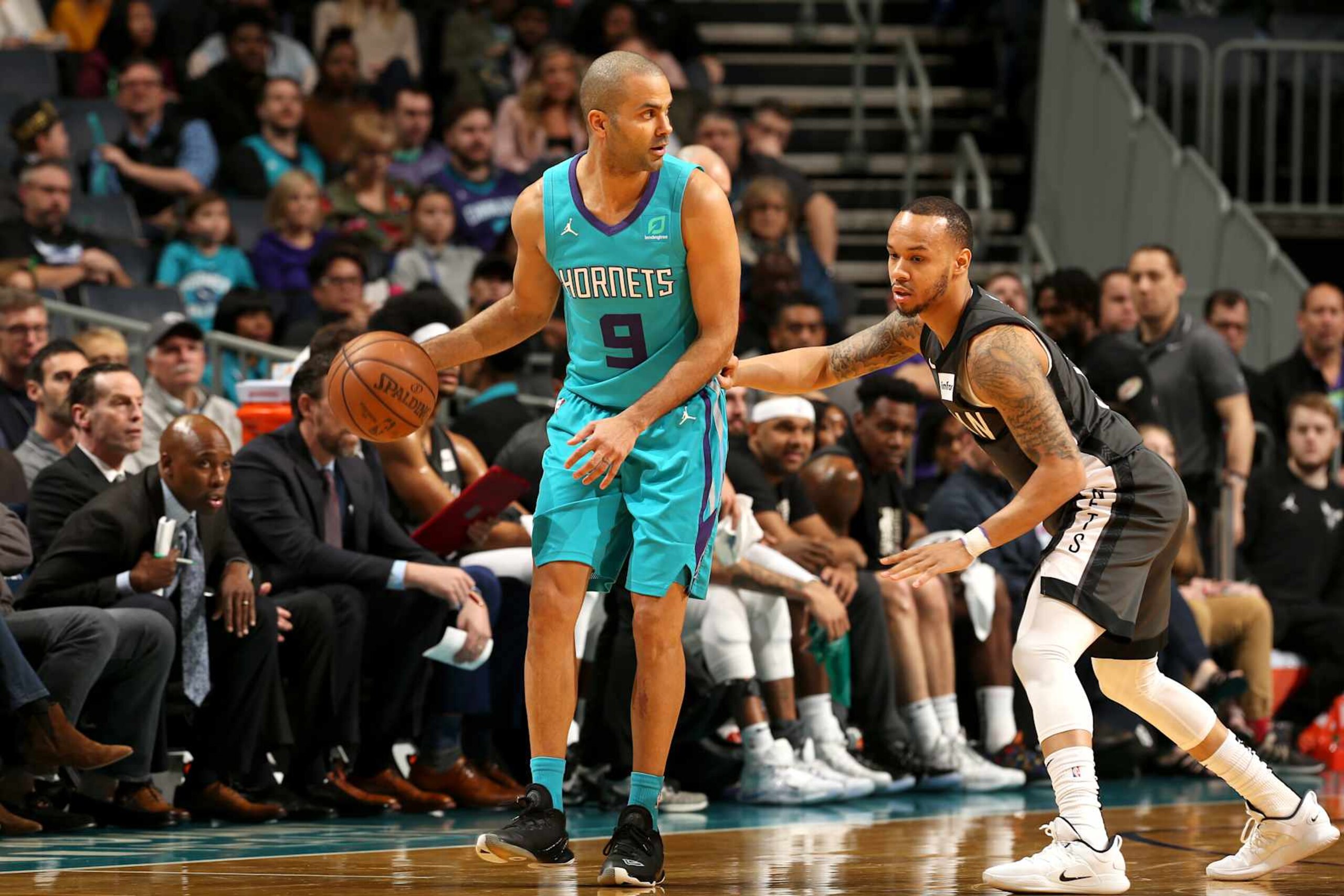 CHARLOTTE, NC - FEBRUARY 23: Tony Parker #9 of the Charlotte Hornets handles the ball against the Brooklyn Nets on February 23, 2019 at Spectrum Center in Charlotte, North Carolina. NOTE TO USER: User expressly acknowledges and agrees that, by downloading and or using this photograph, User is consenting to the terms and conditions of the Getty Images License Agreement. Mandatory Copyright Notice: Copyright 2019 NBAE (Photo by Kent Smith/NBAE via Getty Images) CHARLOTTE, NC - FEBRUARY 23: Tony Parker #9 of the Charlotte Hornets handles the ball against the Brooklyn Nets on February 23, 2019 at Spectrum Center in Charlotte, North Carolina. NOTE TO USER: User expressly acknowledges and agrees that, by downloading and or using this photograph, User is consenting to the terms and conditions of the Getty Images License Agreement. Mandatory Copyright Notice: Copyright 2019 NBAE (Photo by Kent Smith/NBAE via Getty Images)