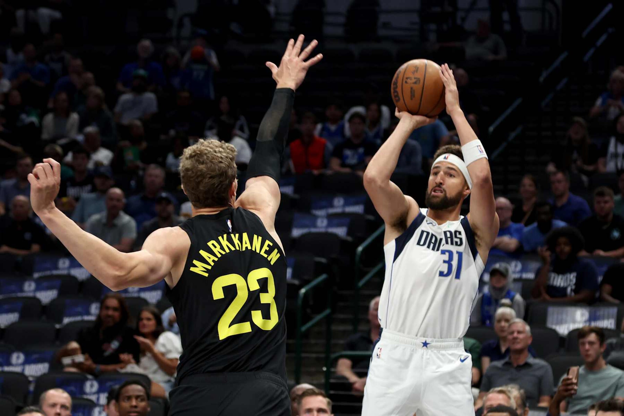 DALLAS, TEXAS - OCTOBER 10: Klay Thompson #31 of the Dallas Mavericks shoots the ball against Lauri Markkanen #23 of the Utah Jazz during the first quarter at American Airlines Center on October 10, 2024 in Dallas, Texas. NOTE TO USER: User expressly acknowledges and agrees that, by downloading and or using this Photograph, user is consenting to the terms and conditions of the Getty Images License Agreement. Mandatory Copyright Notice: Copyright 2024 NBAE (Photo by Tim Heitman/Getty Images) DALLAS, TEXAS - OCTOBER 10: Klay Thompson #31 of the Dallas Mavericks shoots the ball against Lauri Markkanen #23 of the Utah Jazz during the first quarter at American Airlines Center on October 10, 2024 in Dallas, Texas. NOTE TO USER: User expressly acknowledges and agrees that, by downloading and or using this Photograph, user is consenting to the terms and conditions of the Getty Images License Agreement. Mandatory Copyright Notice: Copyright 2024 NBAE (Photo by Tim Heitman/Getty Images)