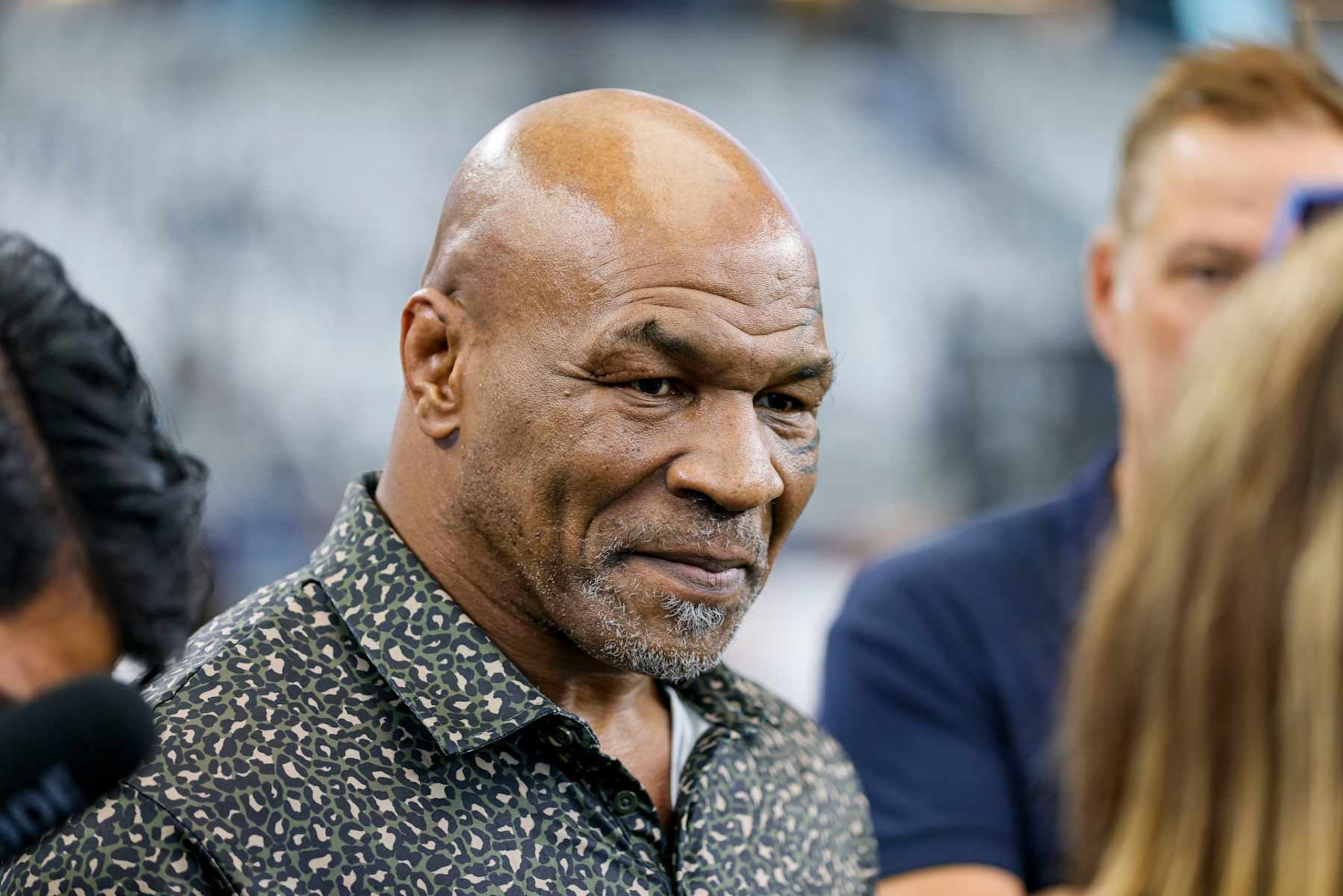 ARLINGTON, TX - SEPTEMBER 15: American professional boxer Mike Tyson does an interview before the game between the Dallas Cowboys and the New Orleans Saints on September 15, 2024 at AT&T Stadium in Arlington, Texas. (Photo by Matthew Pearce/Icon Sportswire via Getty Images)