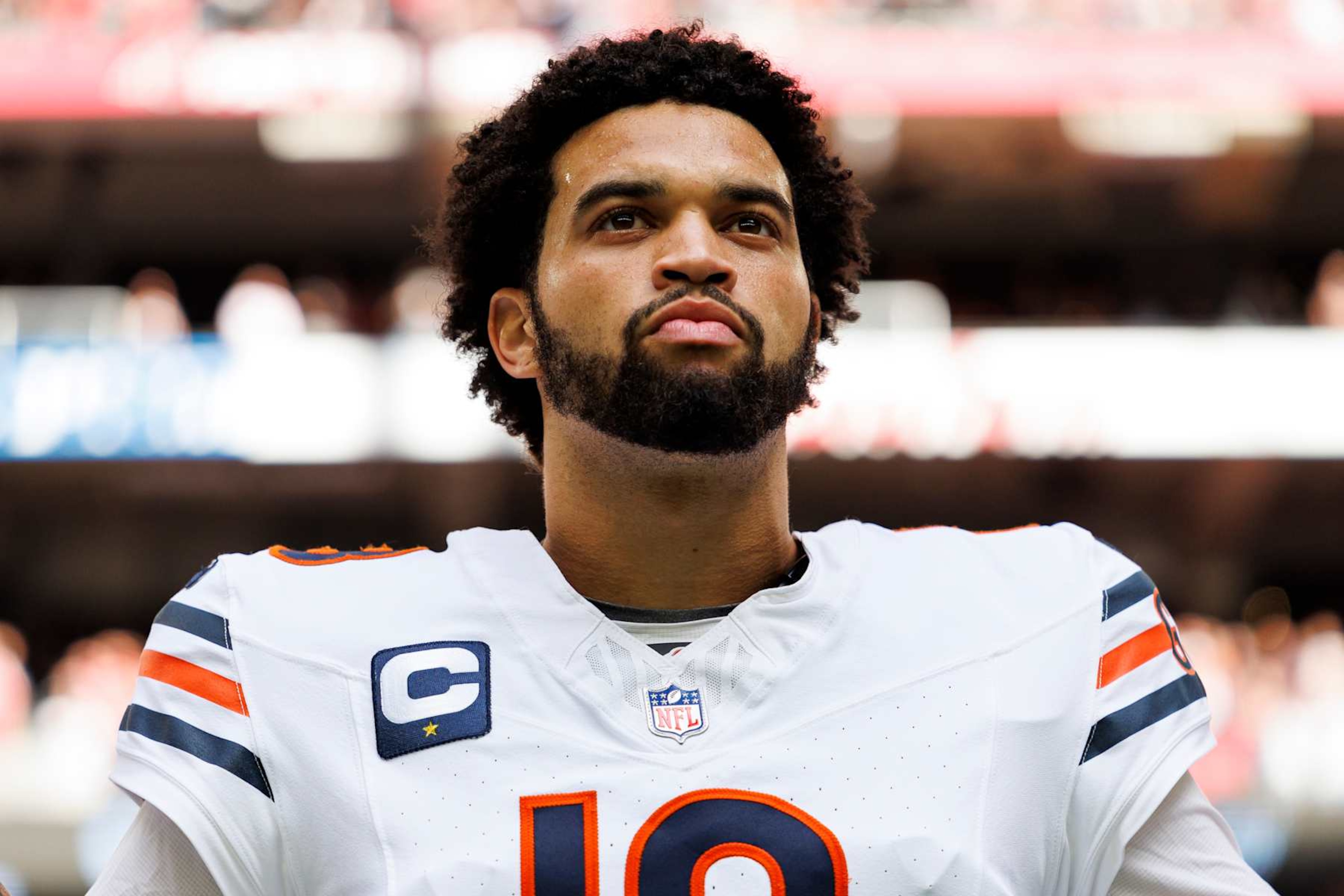 GLENDALE, ARIZONA - NOVEMBER 3: Quarterback Caleb Williams #18 of the Chicago Bears stands on the sidelines during the national anthem prior to an NFL game against the Arizona Cardinals at State Farm Stadium on November 3, 2024 in Glendale, Arizona. (Photo by Brooke Sutton/Getty Images) GLENDALE, ARIZONA - NOVEMBER 3: Quarterback Caleb Williams #18 of the Chicago Bears stands on the sidelines during the national anthem prior to an NFL game against the Arizona Cardinals at State Farm Stadium on November 3, 2024 in Glendale, Arizona. (Photo by Brooke Sutton/Getty Images)