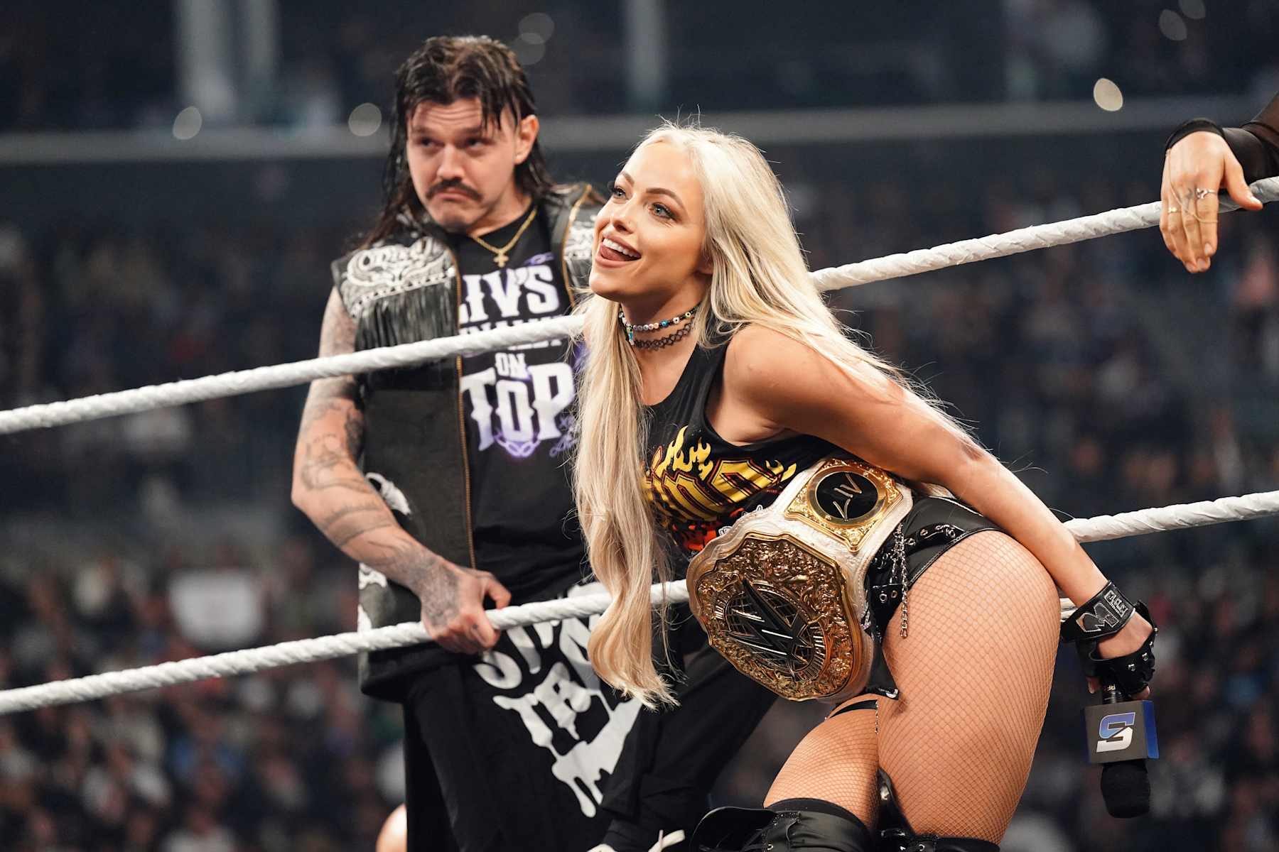 NEW YORK, NEW YORK - NOVEMBER 1: WWE Women's World Champion Liv Morgan and Dominik Mysterio look on during WWE SmackDown at Barclays Center on November 1, 2024 in New York City.  (Photo by WWE/Getty Images)
