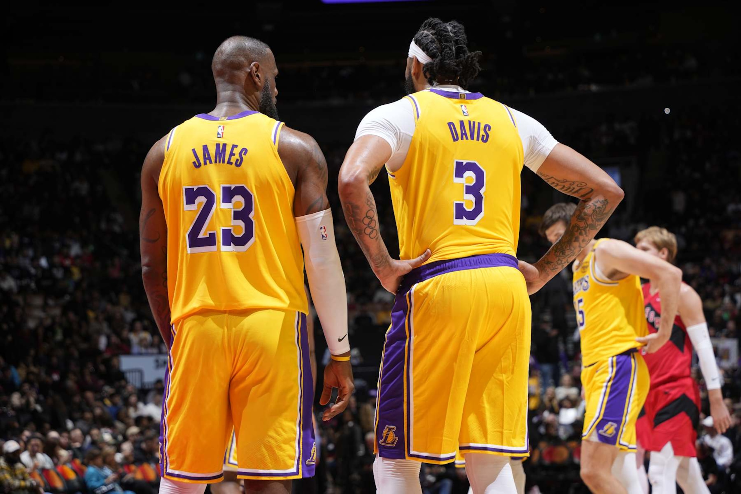 TORONTO, CANADA - NOVEMBER 1: LeBron James #23 and Anthony Davis #3 of the Los Angeles Lakers speak during the game against the Toronto Raptors on November 1, 2024 at the Scotiabank Arena in Toronto, Ontario, Canada.  NOTE TO USER: User expressly acknowledges and agrees that, by downloading and or using this Photograph, user is consenting to the terms and conditions of the Getty Images License Agreement.  Mandatory Copyright Notice: Copyright 2024 NBAE (Photo by Mark Blinch/NBAE via Getty Images)