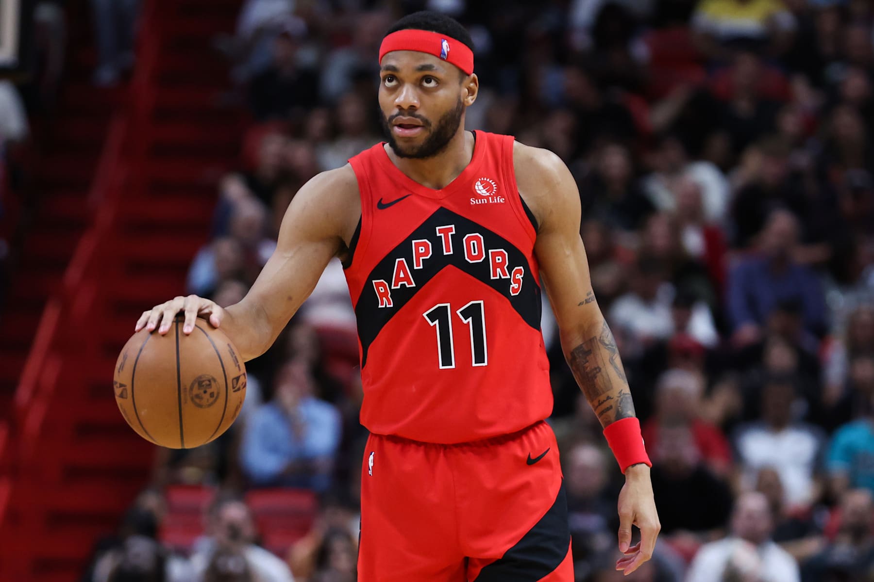 MIAMI, FLORIDA - APRIL 12: Bruce Brown #11 of the Toronto Raptors dribbles the ball against the Miami Heat during the third quarter of the game at Kaseya Center on April 12, 2024 in Miami, Florida. NOTE TO USER: User expressly acknowledges and agrees that, by downloading and or using this photograph, User is consenting to the terms and conditions of the Getty Images License Agreement. (Photo by Megan Briggs/Getty Images)