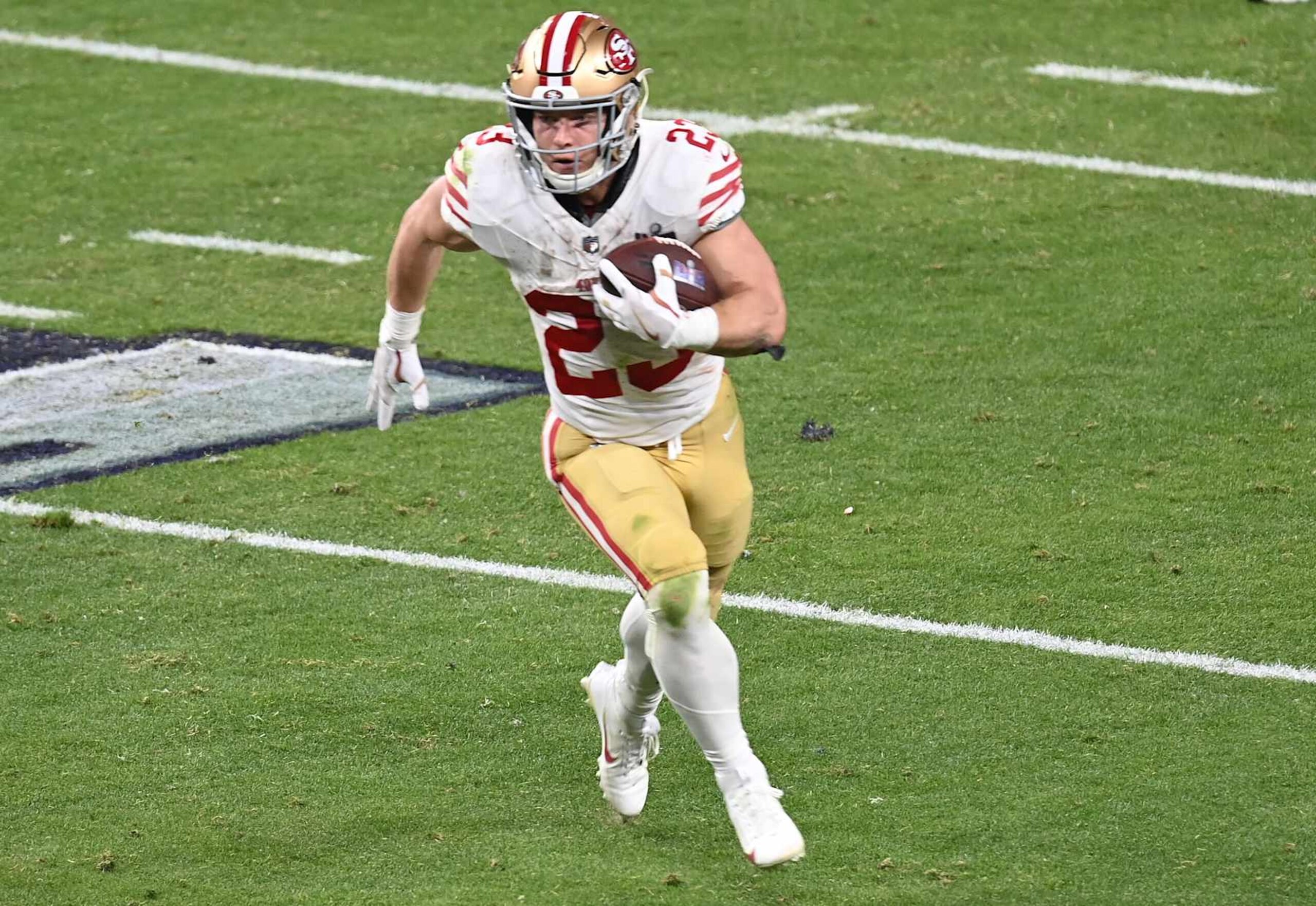 LAS VEGAS, NEVADA - FEBRUARY 11: Christian McCaffrey #23 of the San Francisco 49ers carries the ball against the Kansas City Chiefs in the second half during Super Bowl LVIII at Allegiant Stadium on February 11, 2024 in Las Vegas, Nevada. (Photo by Focus on Sport/Getty Images)