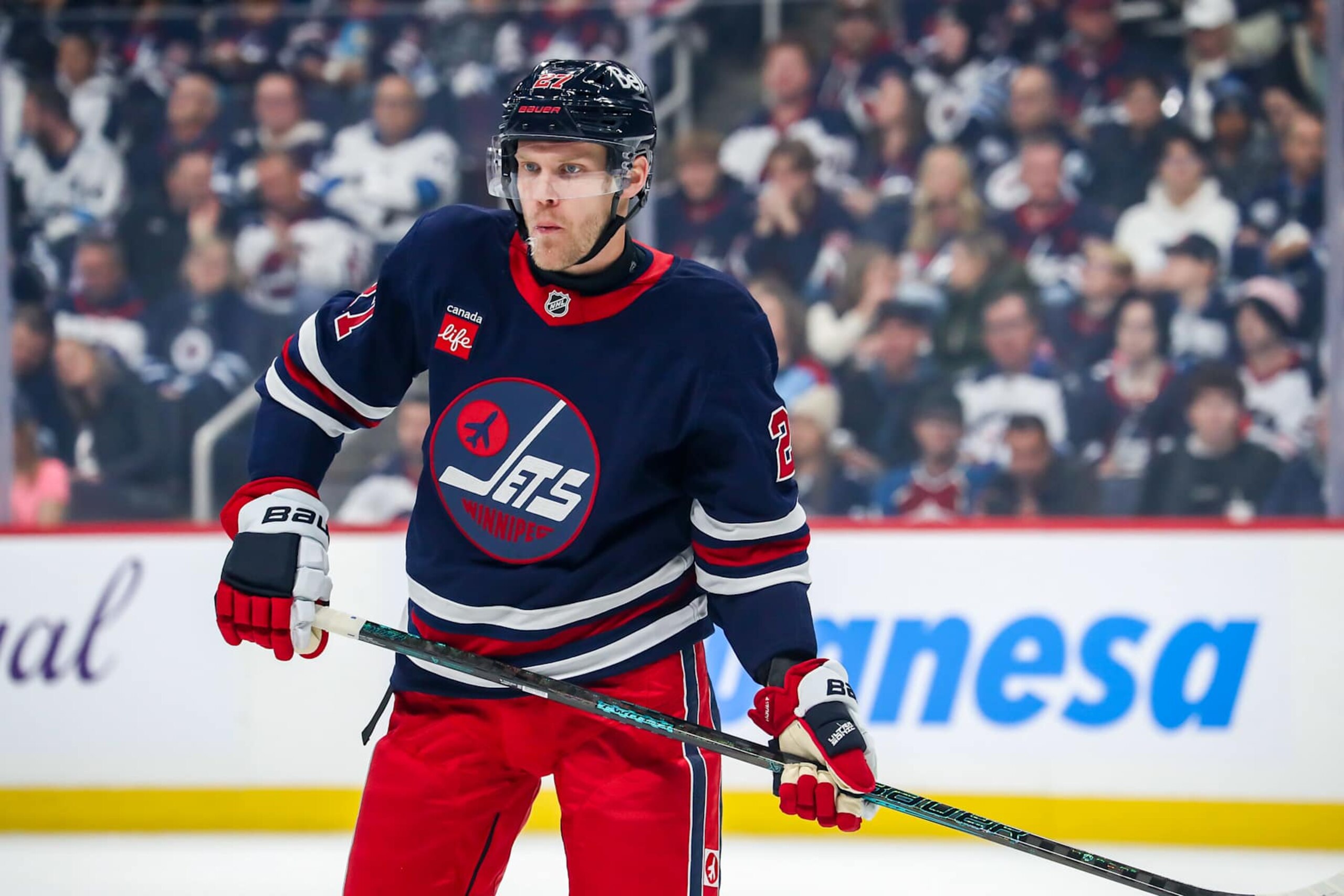 WINNIPEG, CANADA - OCTOBER 18: Nikolaj Ehlers #27 of the Winnipeg Jets looks on during a first period stoppage in play against the San Jose Sharks at the Canada Life Centre on October 18, 2024 in Winnipeg, Manitoba, Canada. The Jets defeated the Sharks 8-3. (Photo by Darcy Finley/NHLI via Getty Images)