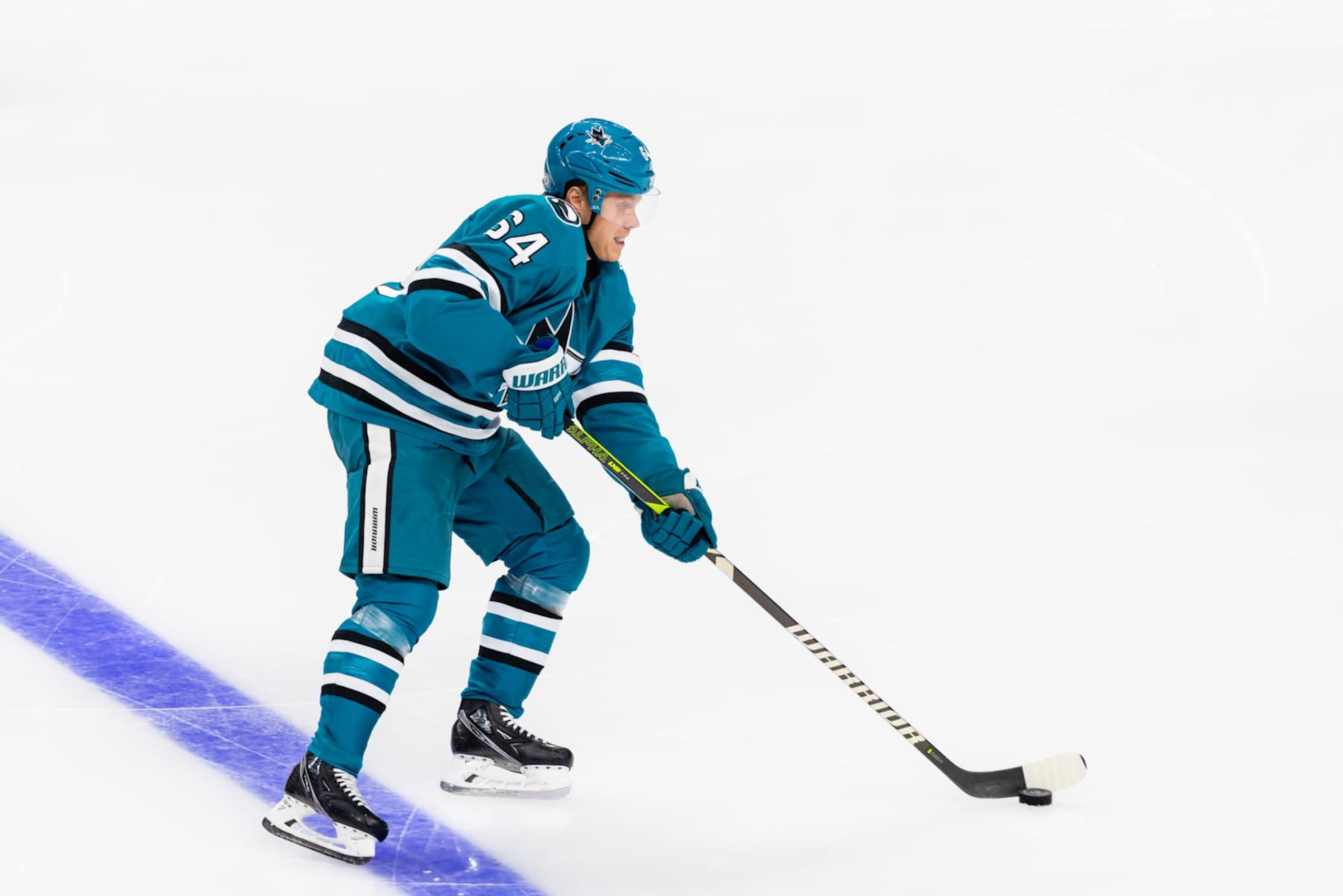 SAN JOSE, CA - NOVEMBER 02: San Jose Sharks center Mikael Granlund (64) looks to pass the puck during a NHL game between the Vancouver Canucks and the San Jose Sharks on November 2, 2024 at SAP Center at San Jose in San Jose, CA. (Photo by Matthew Huang/Icon Sportswire via Getty Images)