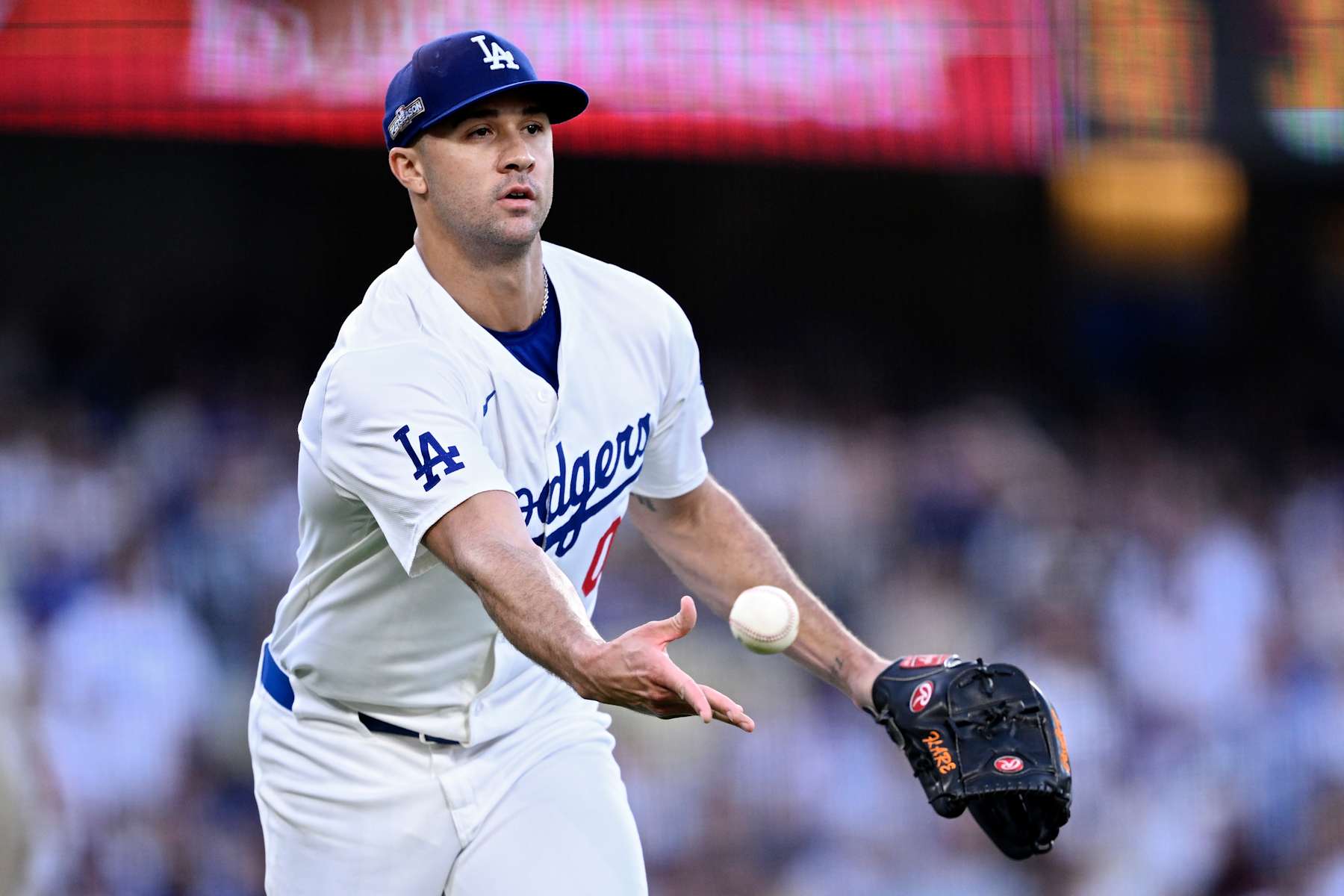 LOS ANGELES, CALIFORNIA - OCTOBER 06: Jack Flaherty #0 of the Los Angeles Dodgers tosses the ball to first base in the third inning against the San Diego Padres during Game Two of the Division Series at Dodger Stadium on October 06, 2024 in Los Angeles, California. (Photo by Orlando Ramirez/Getty Images)