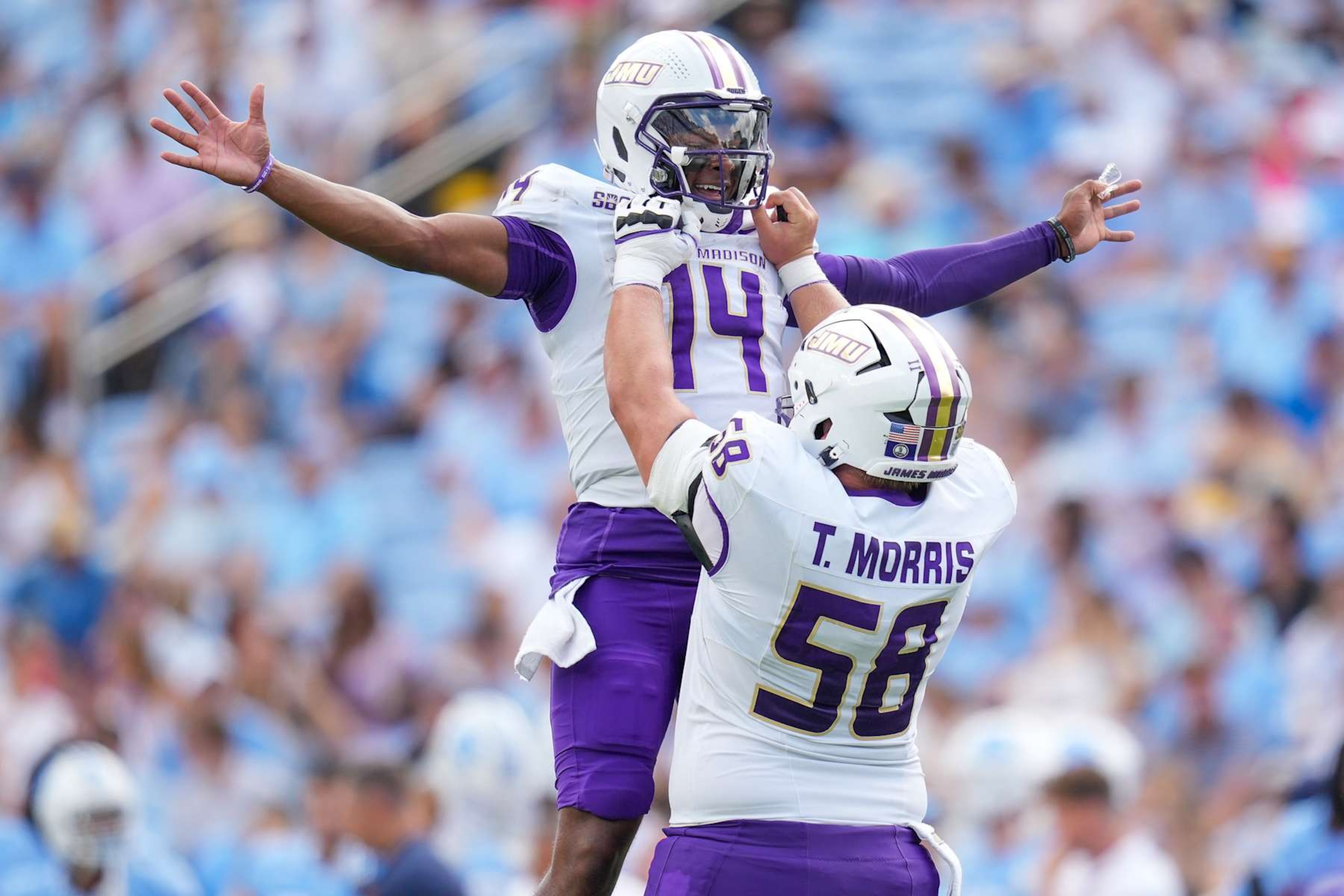 CHAPEL HILL, NORTH CAROLINA - SEPTEMBER 21: Alonza Barnett III #14 celebrates with Tanner Morris #58 of the James Madison Dukes after throwing for a touchdown against the North Carolina Tar Heels during the first half of the game at Kenan Memorial Stadium on September 21, 2024 in Chapel Hill, North Carolina. (Photo by Grant Halverson/Getty Images) CHAPEL HILL, NORTH CAROLINA - SEPTEMBER 21: Alonza Barnett III #14 celebrates with Tanner Morris #58 of the James Madison Dukes after throwing for a touchdown against the North Carolina Tar Heels during the first half of the game at Kenan Memorial Stadium on September 21, 2024 in Chapel Hill, North Carolina. (Photo by Grant Halverson/Getty Images)