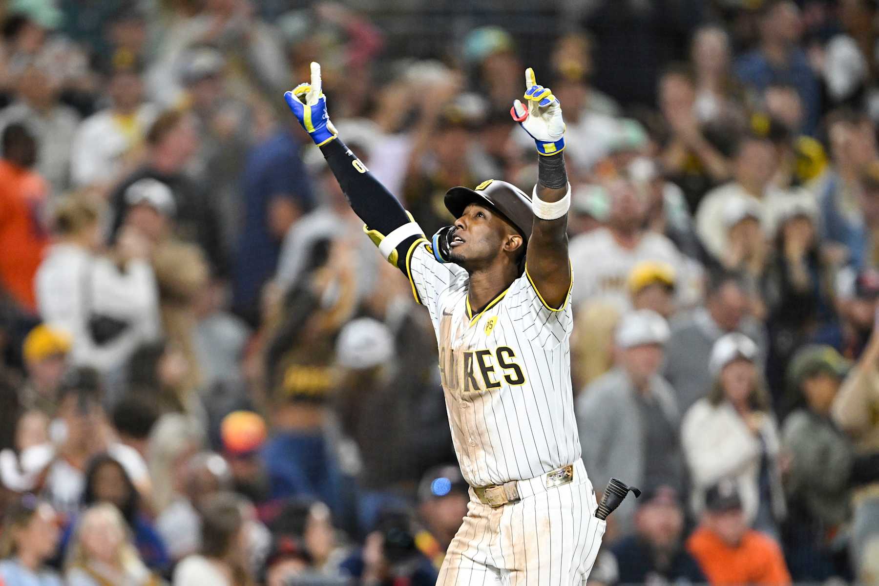 SAN DIEGO, CA - SEPTEMBER 16: Jurickson Profar #10 of the San Diego Padres points skyward after hitting a solo home run during the eighth inning of a baseball game against the Houston Astros, September 16, 2024 at Petco Park in San Diego, California. (Photo by Denis Poroy/Getty Images)
