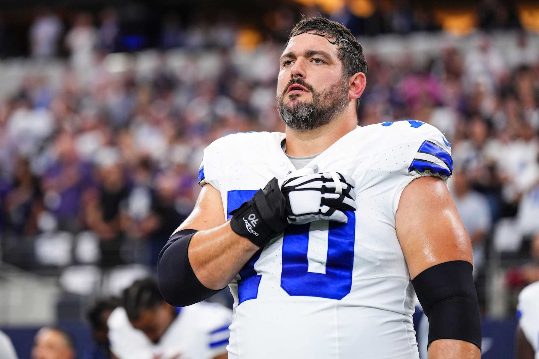 ARLINGTON, TX - SEPTEMBER 22: Zack Martin #70 of the Dallas Cowboys looks on from the sideline prior to an NFL football game against the Baltimore Ravens at AT&T Stadium on September 22, 2024 in Arlington, Texas. (Photo by Cooper Neill/Getty Images)