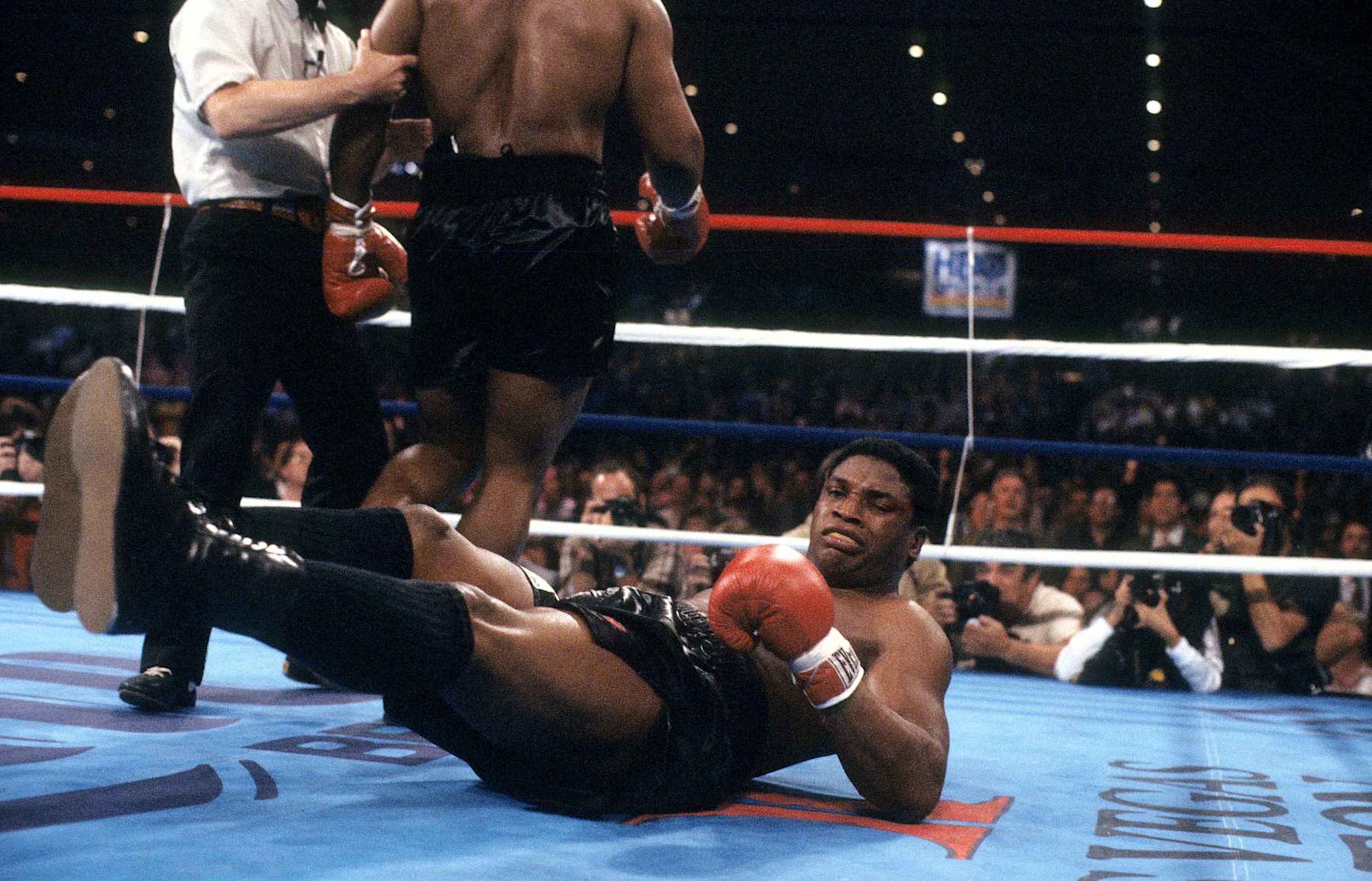 LAS VEGAS - NOVEMBER 22,1986: Trevor Berbick is knocked down by Mike Tyson during the fight at Hilton Hotel in Las Vegas, Nevada. Mike Tyson won the WBC heavyweight title by a TKO 2. (Photo by: The Ring Magazine via Getty Images) 