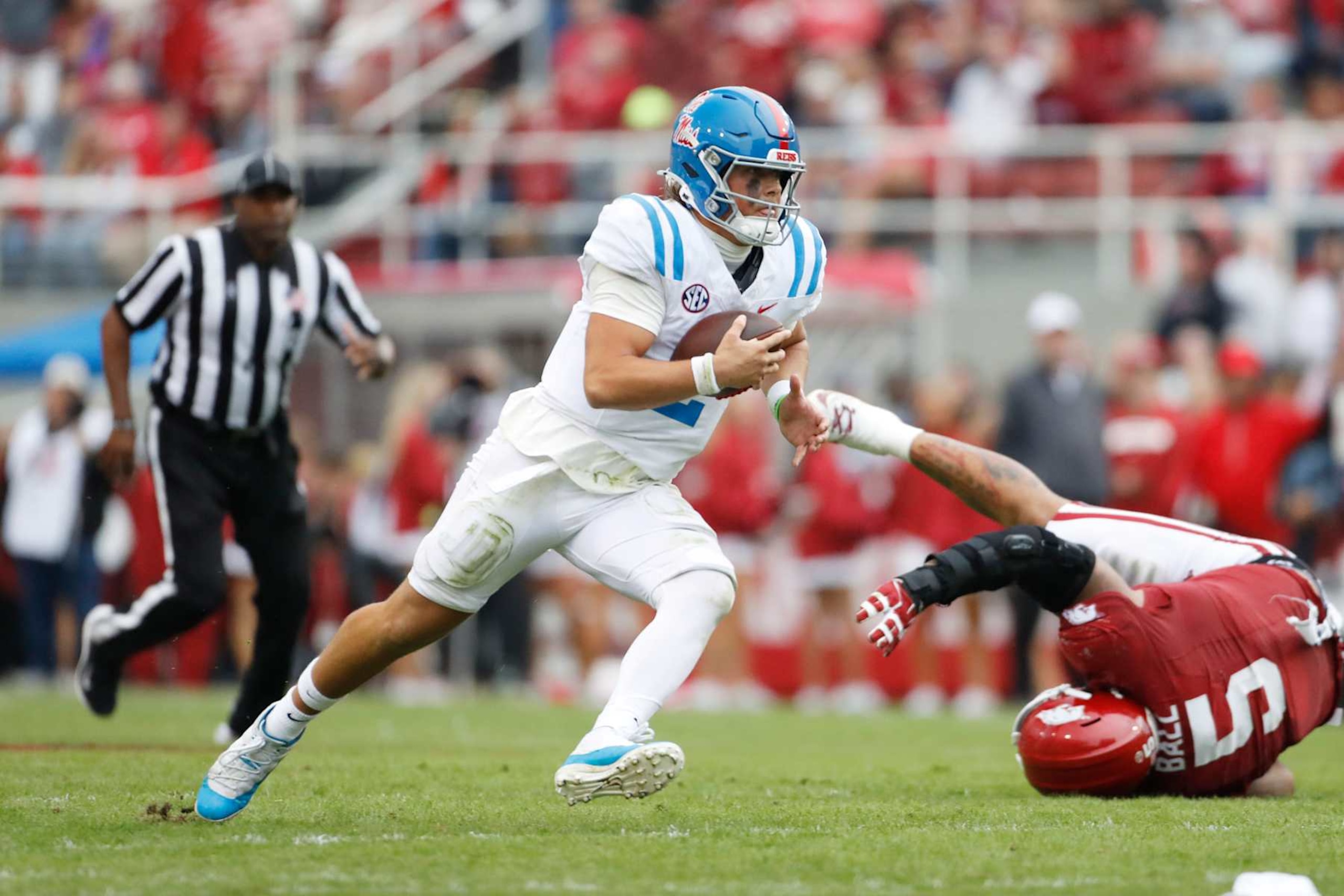 FAYETTEVILLE, AR - NOVEMBER 02:  Mississippi Rebels quarterback Jaxson Dart (2) carries the football during the college football game between the Mississippi Rebels and Arkansas Razorbacks on November 2, 2024, at Donald W. Reynolds Razorback Stadium in Fayetteville, Arkansas. (Photo by Andy Altenburger/Icon Sportswire via Getty Images)