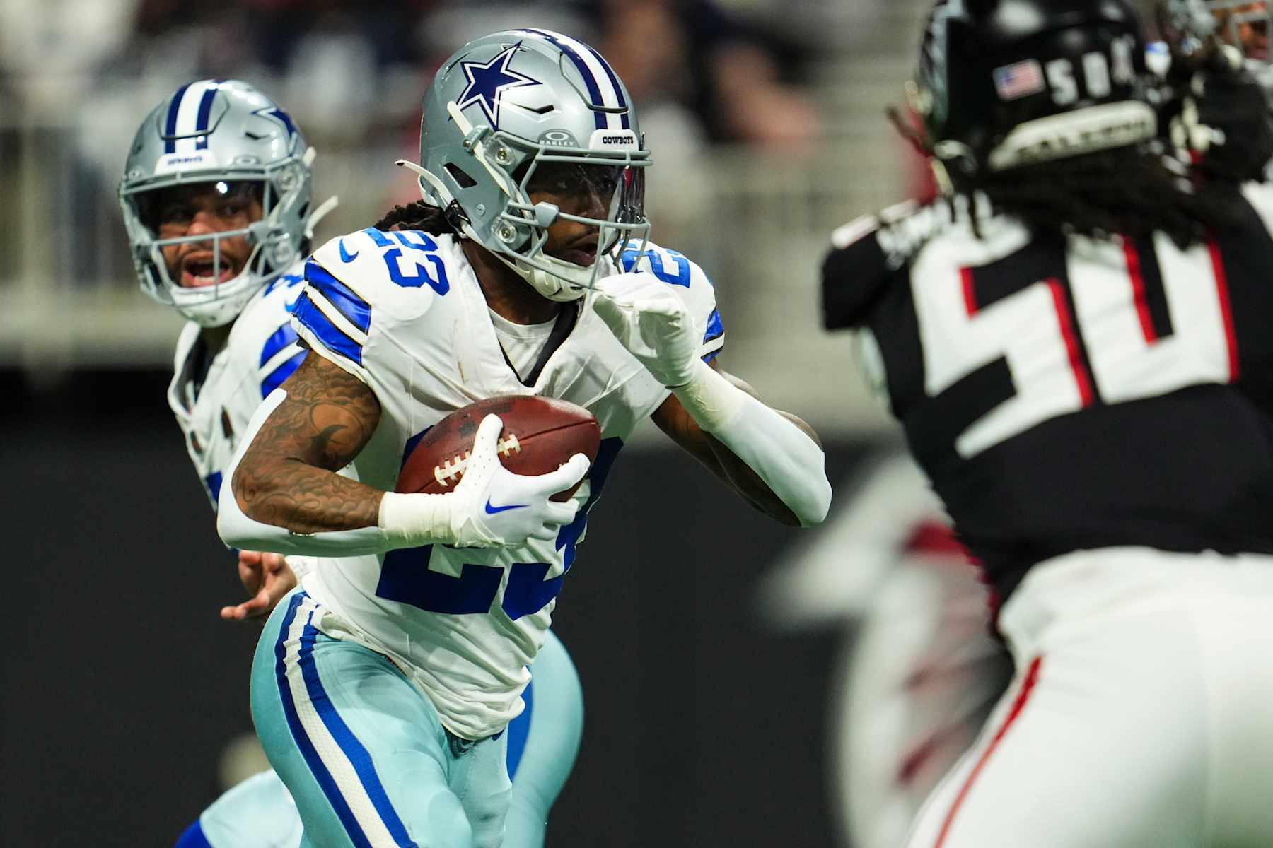 ATLANTA, GA - NOVEMBER 03: Rico Dowdle #23 of the Dallas Cowboys runs the ball during an NFL football game against the Atlanta Falcons at Mercedes-Benz Stadium on November 3, 2024 in Atlanta, Georgia. (Photo by Cooper Neill/Getty Images)