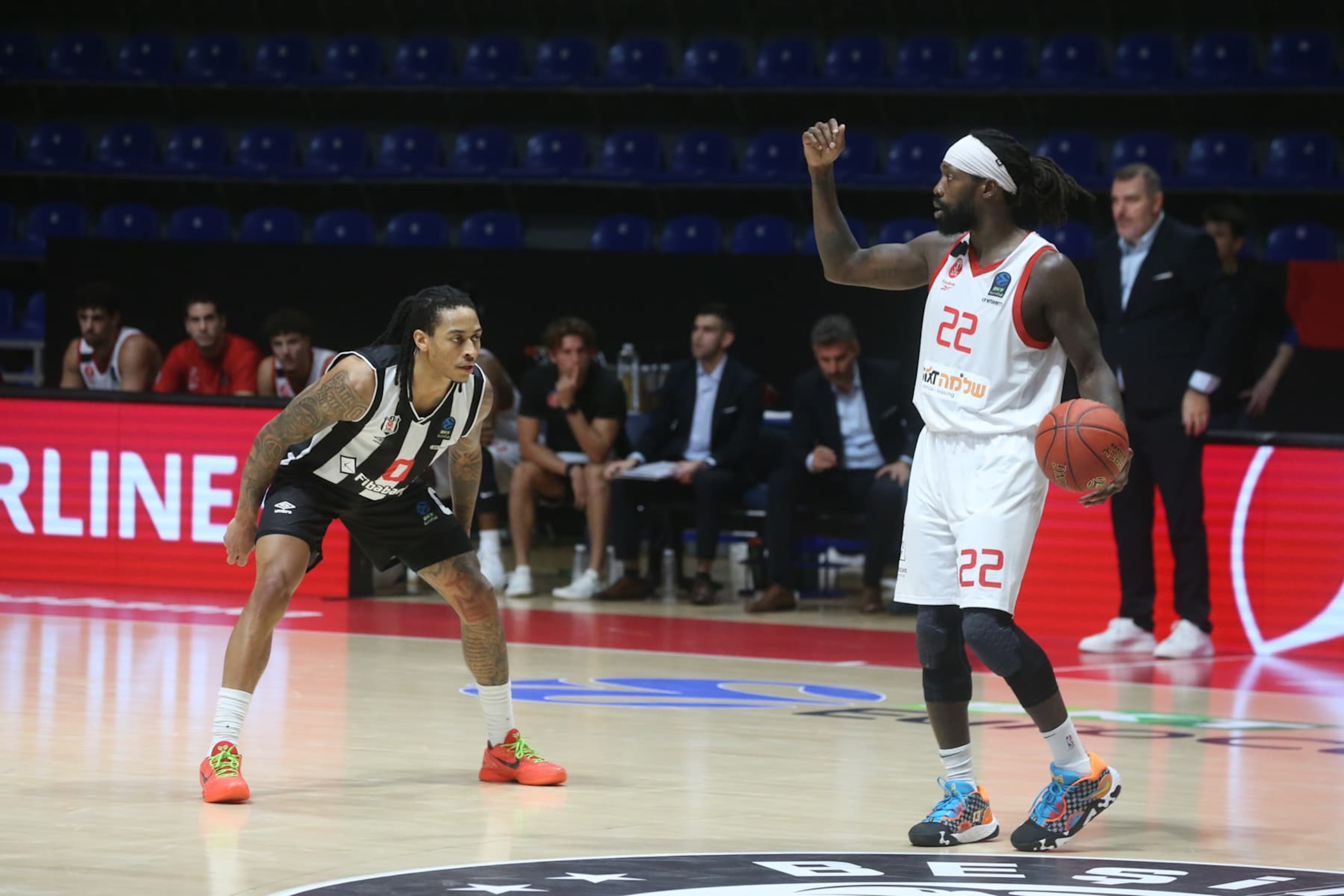 BELGRADE, SERBIA - OCTOBER 08: Kyle Allman (0) of Besiktas Fibabanka in action against Patrick Beverley (22) of Hapoel Shlomo Tel Aviv during the BKT EuroCup Group A week 3 match between Besiktas Fibabanka and Hapoel Shlomo Tel Aviv at Aleksandar Nikolic Hall in Belgrade, Serbia on October 08, 2024. (Photo by Filip Stevanovic/Anadolu via Getty Images)