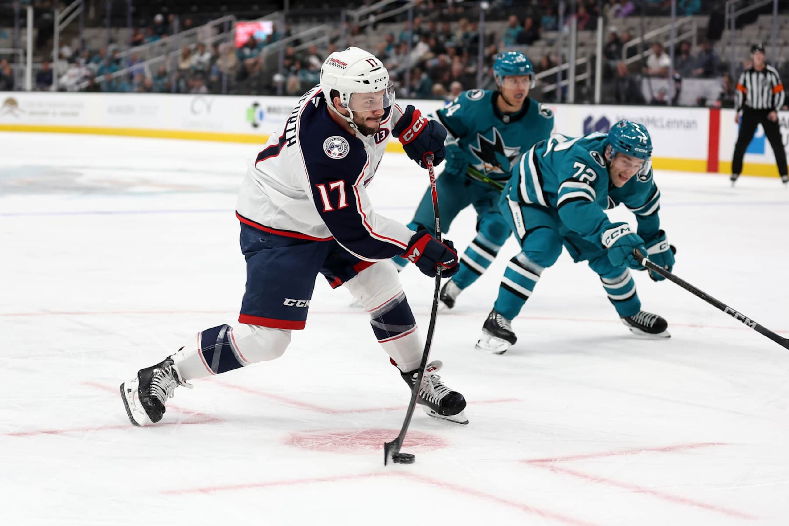 SAN JOSE, CALIFORNIA - NOVEMBER 05: Justin Danforth #17 of the Columbus Blue Jackets puts a shot on goal in front of William Eklund #72 of the San Jose Sharks in the first period at SAP Center on November 05, 2024 in San Jose, California. (Photo by Ezra Shaw/Getty Images) SAN JOSE, CALIFORNIA - NOVEMBER 05: Justin Danforth #17 of the Columbus Blue Jackets puts a shot on goal in front of William Eklund #72 of the San Jose Sharks in the first period at SAP Center on November 05, 2024 in San Jose, California. (Photo by Ezra Shaw/Getty Images)