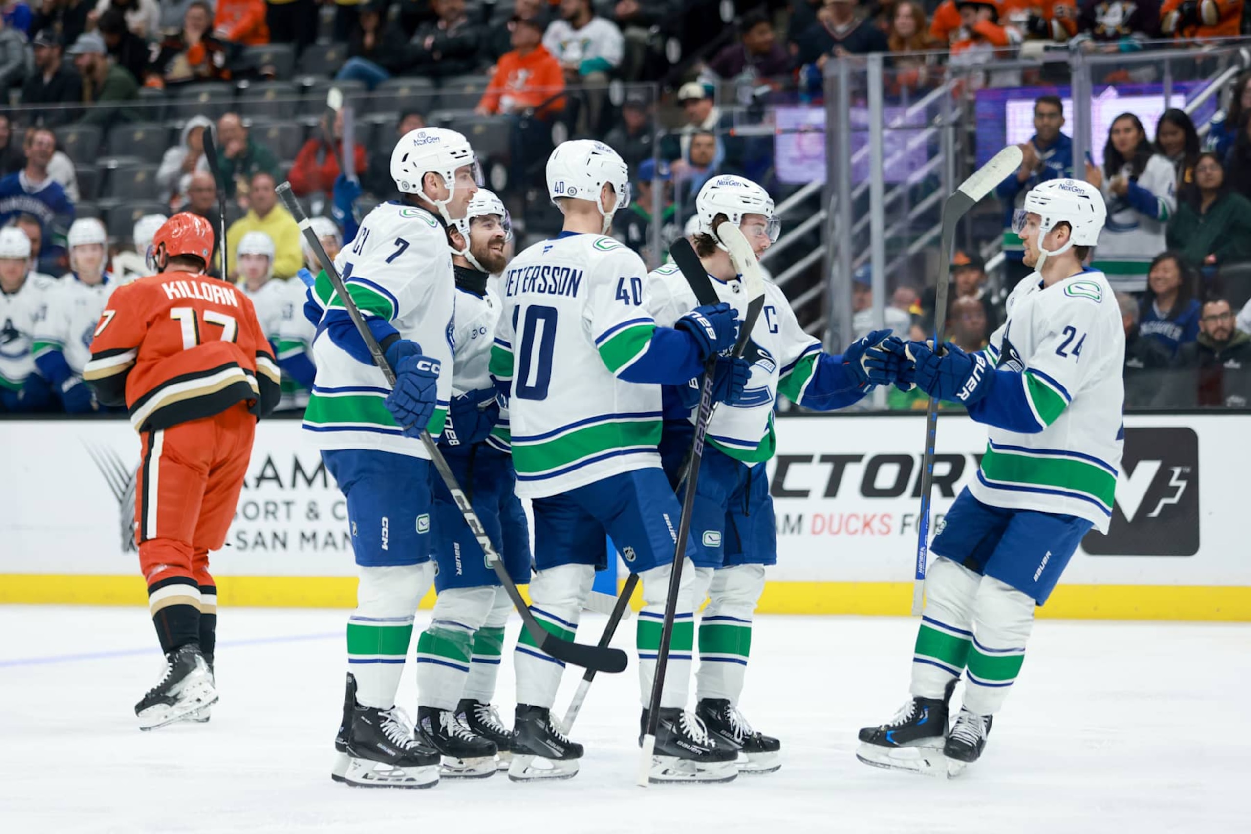 ANAHEIM, CALIFORNIA - NOVEMBER 05: Quinn Hughes #43 of the Vancouver Canucks celebrates scoring a goal with teammates Pius Suter #24, Elias Pettersson #40 and Carson Soucy #7 in the second period during the game against the Anaheim Ducks at Honda Center on November 05, 2024 in Anaheim, California. (Photo by Nicole Vasquez /NHLI via Getty Images) ANAHEIM, CALIFORNIA - NOVEMBER 05: Quinn Hughes #43 of the Vancouver Canucks celebrates scoring a goal with teammates Pius Suter #24, Elias Pettersson #40 and Carson Soucy #7 in the second period during the game against the Anaheim Ducks at Honda Center on November 05, 2024 in Anaheim, California. (Photo by Nicole Vasquez /NHLI via Getty Images)
