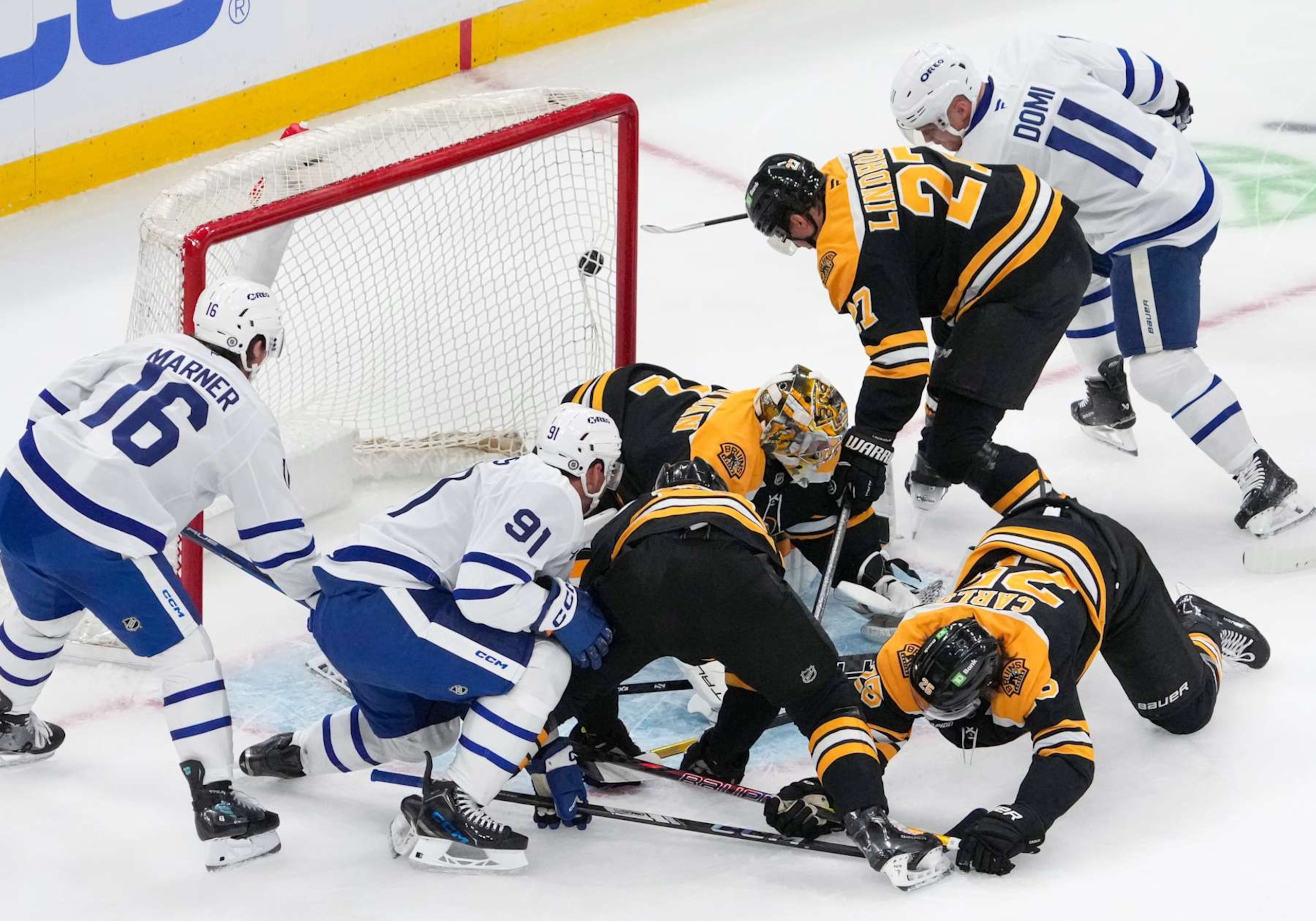 Boston, MA - October 26: A shot by Toronto Maple Leafs C Max Domi goes wide of the net during a scrum in the crease on Toronto power play in the first period. (Photo by Barry Chin/The Boston Globe via Getty Images) Boston, MA - October 26: A shot by Toronto Maple Leafs C Max Domi goes wide of the net during a scrum in the crease on Toronto power play in the first period. (Photo by Barry Chin/The Boston Globe via Getty Images)
