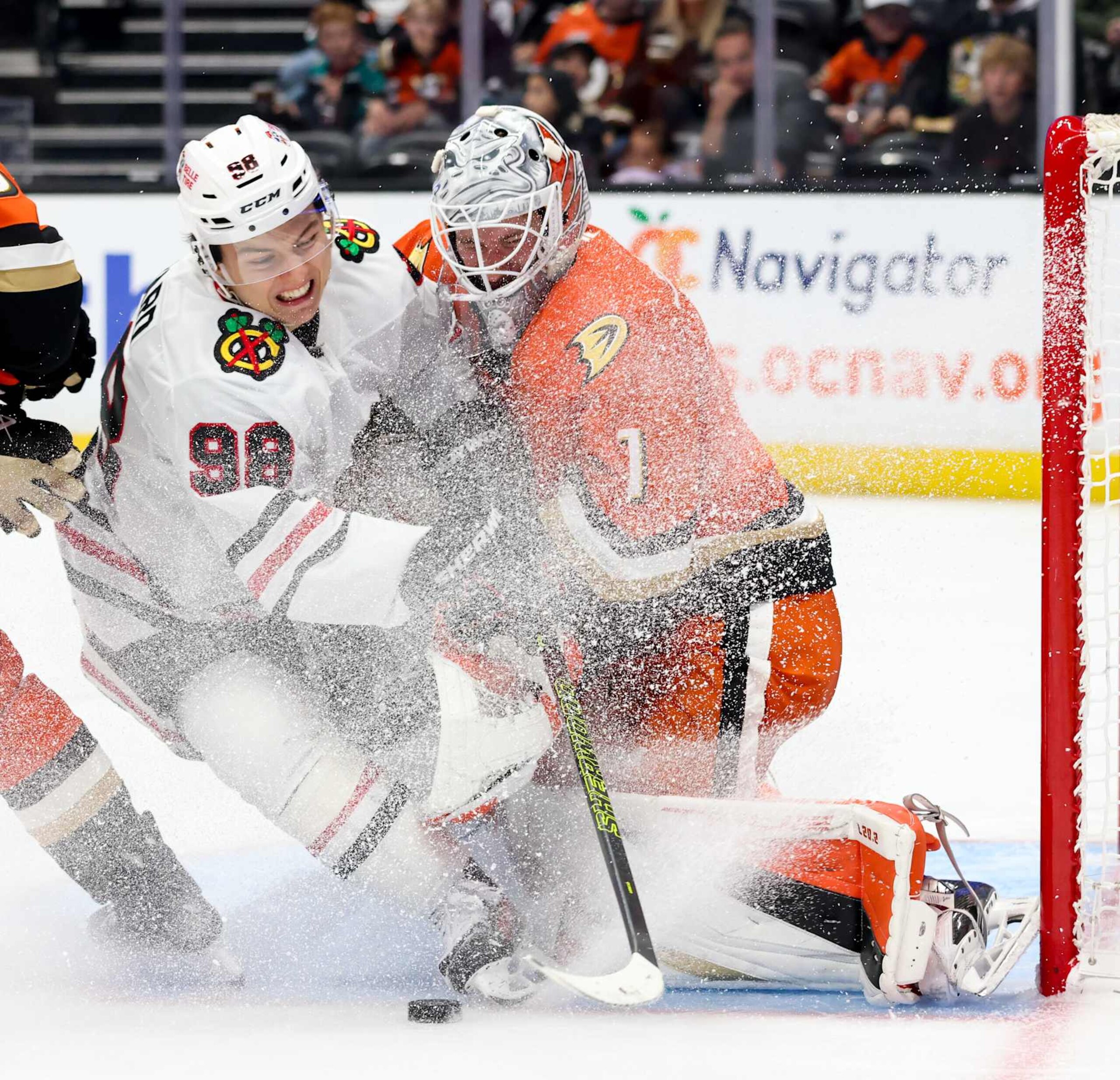 ANAHEIM, CA - NOVEMBER 3: Connor Bedard #98 of the Chicago Blackhawks slides into Lukas Dostal #1 of the Anaheim Ducks during the second period at Honda Center on November 3, 2024 in Anaheim, California. (Photo by Debora Robinson/NHLI via Getty Images) ANAHEIM, CA - NOVEMBER 3: Connor Bedard #98 of the Chicago Blackhawks slides into Lukas Dostal #1 of the Anaheim Ducks during the second period at Honda Center on November 3, 2024 in Anaheim, California. (Photo by Debora Robinson/NHLI via Getty Images)