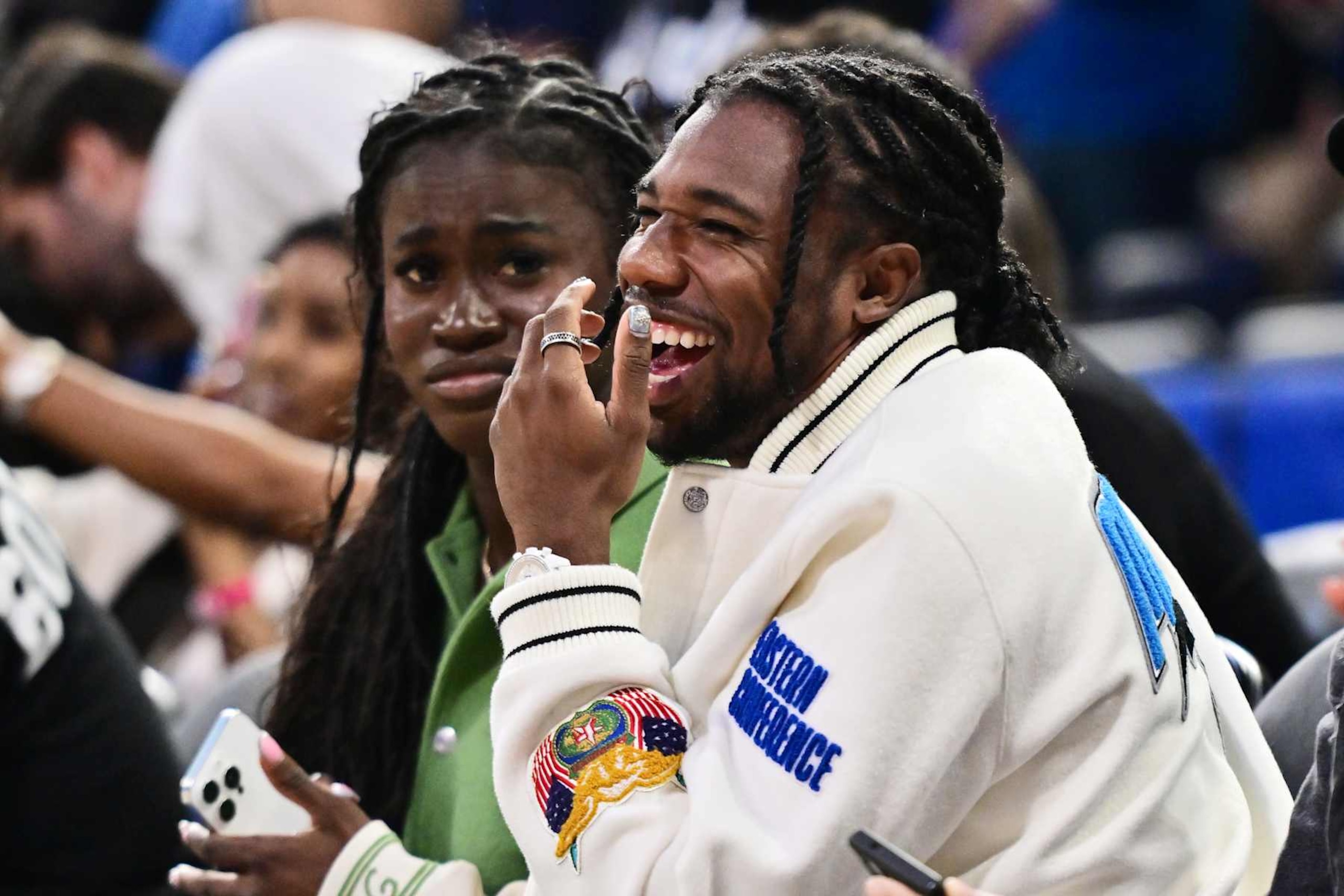 ORLANDO, FLORIDA - OCTOBER 18: Team USA gold medalist Noah Lyles reacts during a preseason NBA game between the Orlando Magic and the Philadelphia 76ers at Kia Center on October 18, 2024 in Orlando, Florida. NOTE TO USER: User expressly acknowledges and agrees that, by downloading and or using this photograph, User is consenting to the terms and conditions of the Getty Images License Agreement. (Photo by Julio Aguilar/Getty Images)