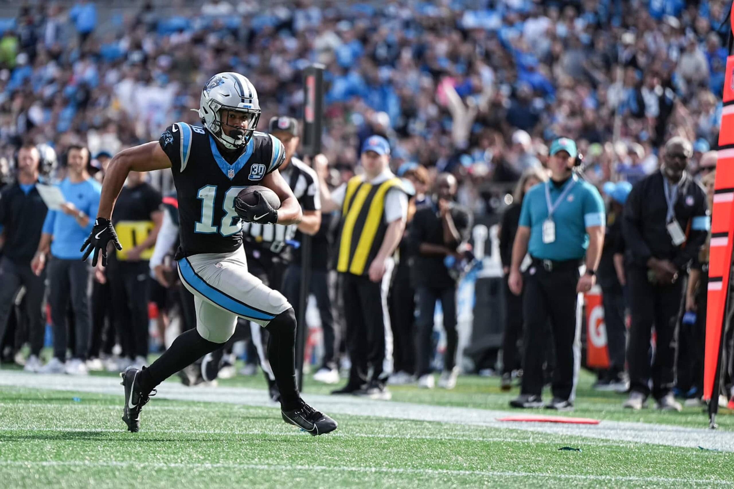 CHARLOTTE, NORTH CAROLINA - NOVEMBER 03: Jalen Coker #18 of the Carolina Panthers runs for a first down during the second quarter of his game against the New Orleans Saints at Bank of America Stadium on November 03, 2024 in Charlotte, North Carolina. (Photo by Matt Kelley/Getty Images) CHARLOTTE, NORTH CAROLINA - NOVEMBER 03: Jalen Coker #18 of the Carolina Panthers runs for a first down during the second quarter of his game against the New Orleans Saints at Bank of America Stadium on November 03, 2024 in Charlotte, North Carolina. (Photo by Matt Kelley/Getty Images)