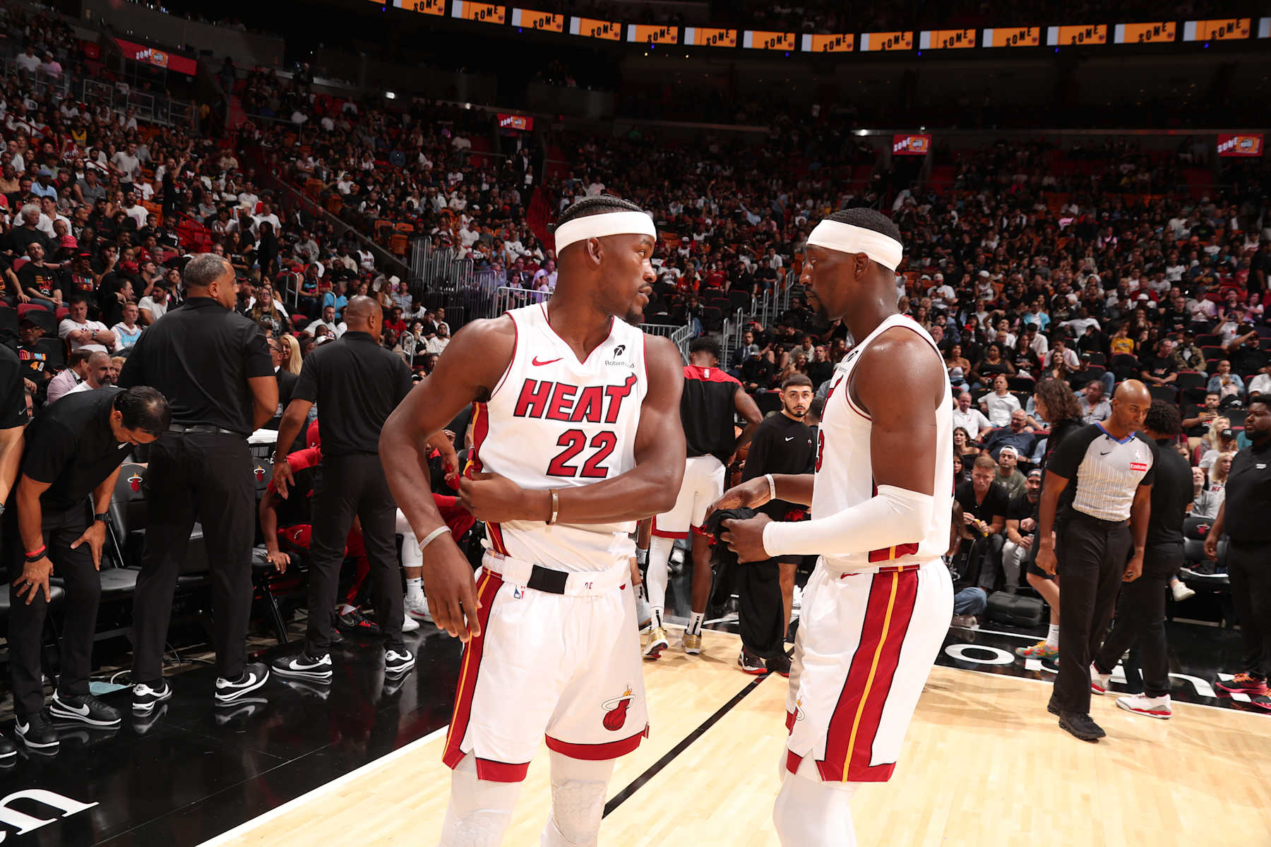 MIAMI, FL - OCTOBER 23: Jimmy Butler #22 and Bam Adebayo #13 of the Miami Heat speak during the game against the Orlando Magic on October 23, 2024 at Kaseya Center in Miami, Florida. NOTE TO USER: User expressly acknowledges and agrees that, by downloading and or using this Photograph, user is consenting to the terms and conditions of the Getty Images License Agreement. Mandatory Copyright Notice: Copyright 2024 NBAE (Photo by Issac Baldizon/NBAE via Getty Images)