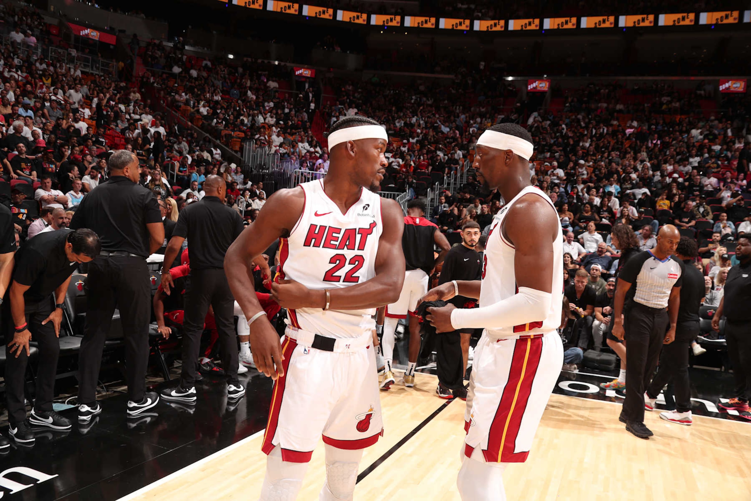 MIAMI, FL - OCTOBER 23: Jimmy Butler #22 and Bam Adebayo #13 of the Miami Heat speak during the game against the Orlando Magic on October 23, 2024 at Kaseya Center in Miami, Florida. NOTE TO USER: User expressly acknowledges and agrees that, by downloading and or using this Photograph, user is consenting to the terms and conditions of the Getty Images License Agreement. Mandatory Copyright Notice: Copyright 2024 NBAE (Photo by Issac Baldizon/NBAE via Getty Images)
