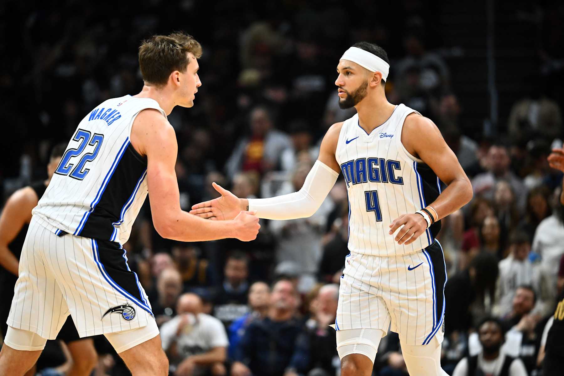 CLEVELAND, OHIO - MAY 05: Franz Wagner #22 talks to Jalen Suggs #4 of the Orlando Magic during the third quarter of Game Seven of the Eastern Conference First Round Playoffs against the Cleveland Cavaliers at Rocket Mortgage Fieldhouse on May 05, 2024 in Cleveland, Ohio. The Cavaliers defeated the Magic 106-94. NOTE TO USER: User expressly acknowledges and agrees that, by downloading and/or using this Photograph, user is consenting to the terms and conditions of the Getty Images License Agreement. (Photo by Jason Miller/Getty Images)