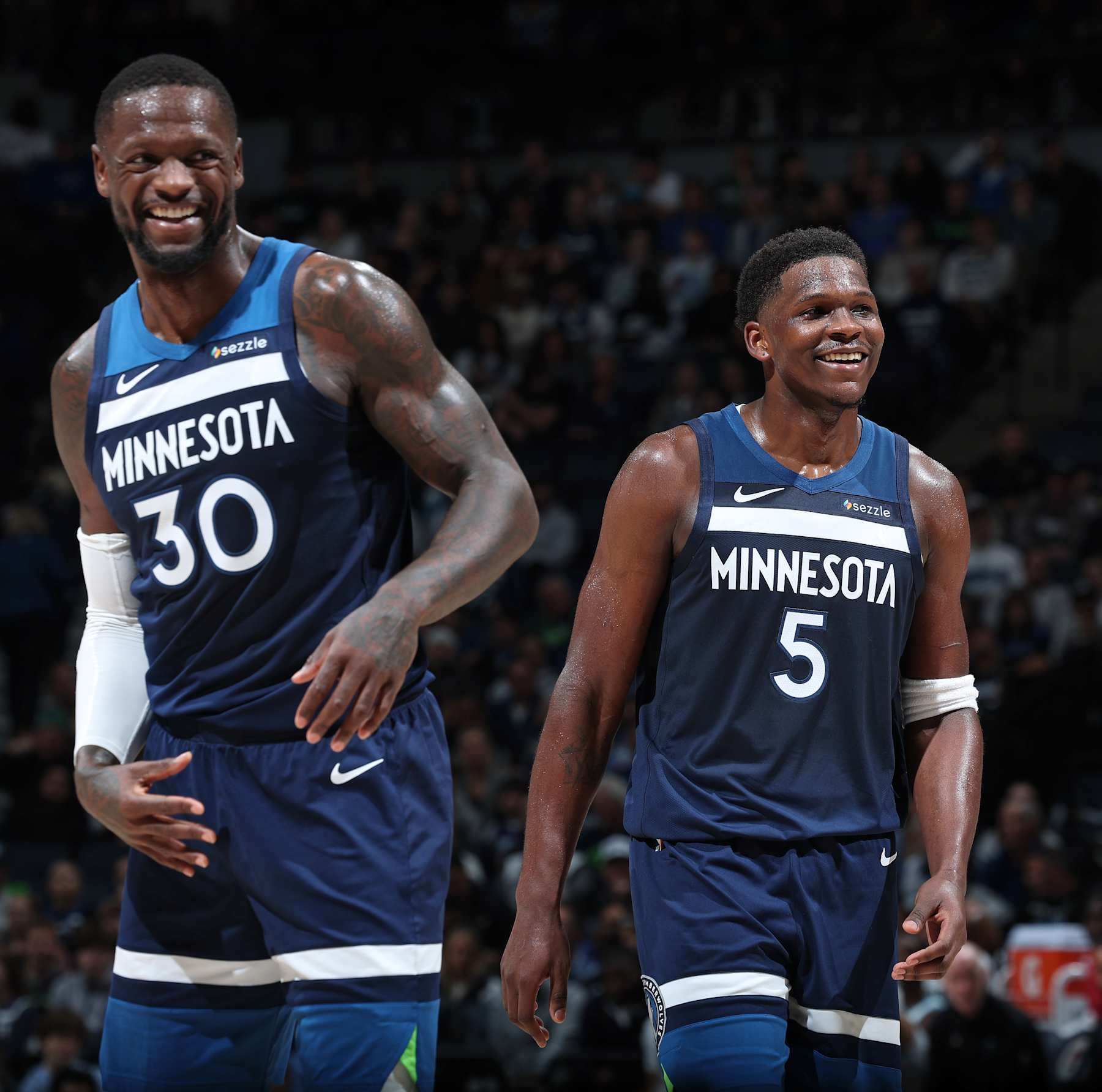 MINNEAPOLIS, MN -  NOVEMBER 4: Anthony Edwards #5 and Julius Randle #30 of the Minnesota Timberwolves smiles during the game against the Charlotte Hornets on November 4, 2024 at Target Center in Minneapolis, Minnesota. NOTE TO USER: User expressly acknowledges and agrees that, by downloading and or using this Photograph, user is consenting to the terms and conditions of the Getty Images License Agreement. Mandatory Copyright Notice: Copyright 2024 NBAE (Photo by David Sherman/NBAE via Getty Images)