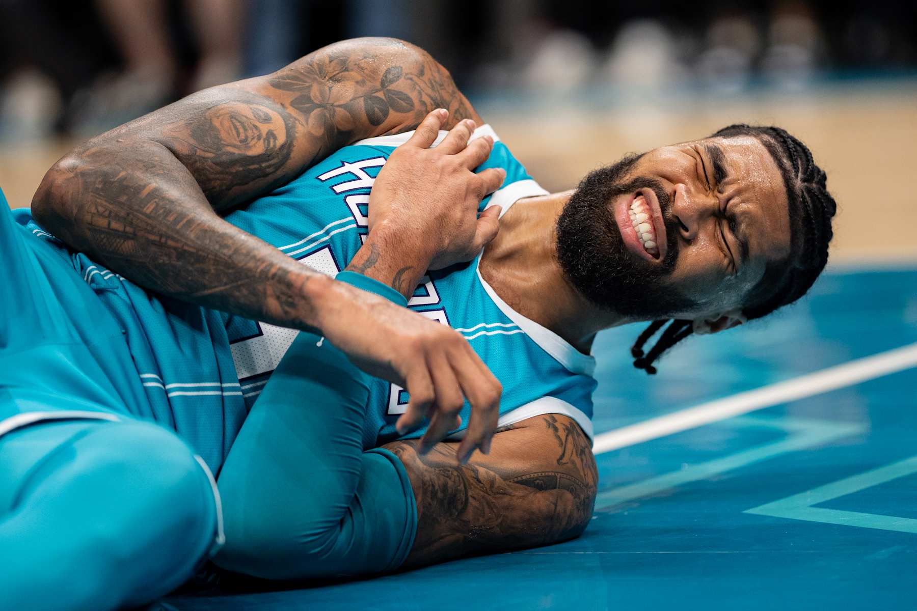 CHARLOTTE, NORTH CAROLINA - NOVEMBER 01: Nick Richards #4 of the Charlotte Hornets is shaken up after a play in the second quarter during their game /B at Spectrum Center on November 01, 2024 in Charlotte, North Carolina. NOTE TO USER: User expressly acknowledges and agrees that, by downloading and or using this photograph, User is consenting to the terms and conditions of the Getty Images License Agreement. (Photo by Jacob Kupferman/Getty Images)