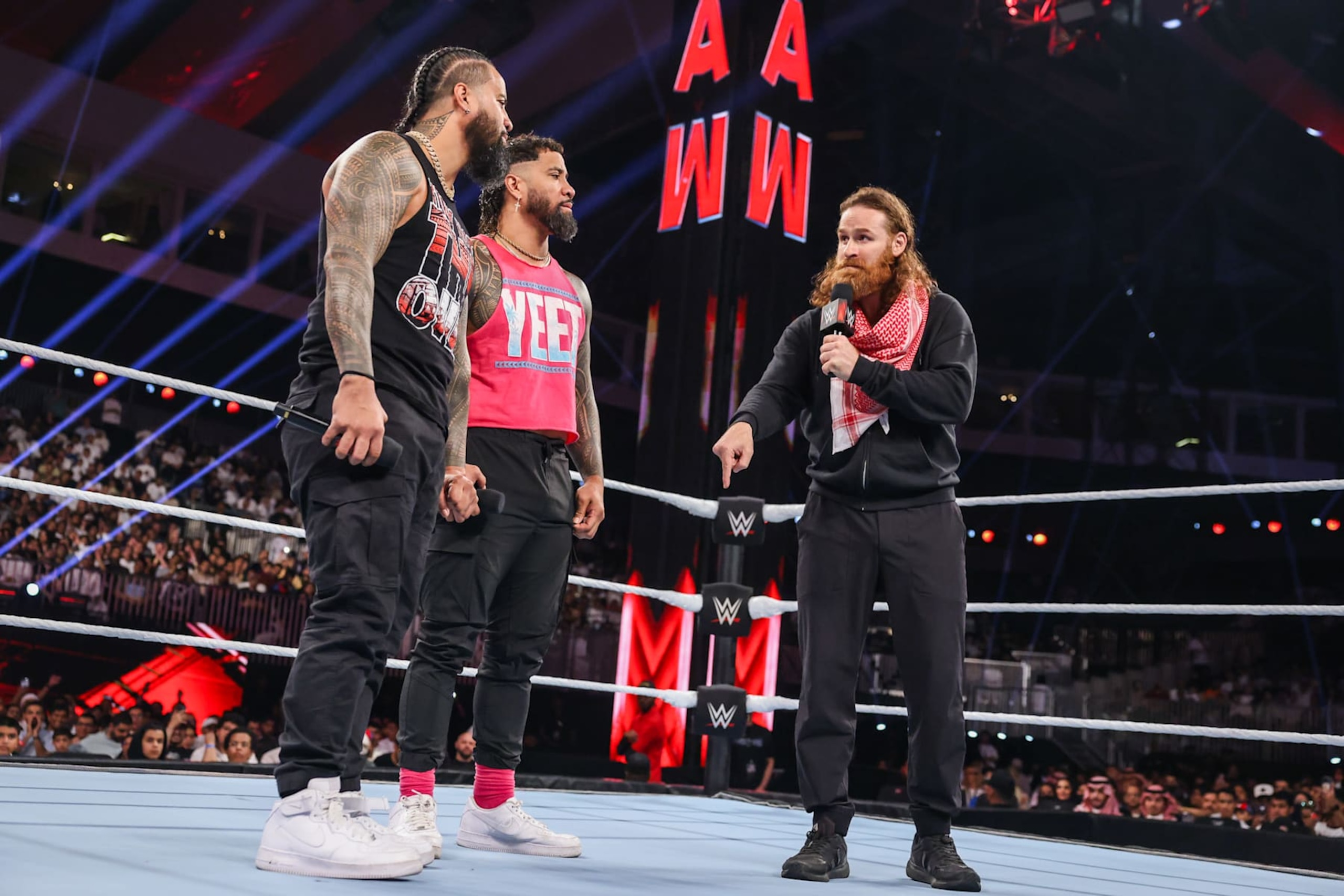 RIYADH, SAUDI ARABIA - NOVEMBER 4: Jimmy Uso, Jey Uso, and Sami Zayn speak during Monday Night RAW at Mohammed Abdo Arena on November 4, 2024 in Riyadh, Saudi Arabia.  (Photo by WWE/Getty Images)