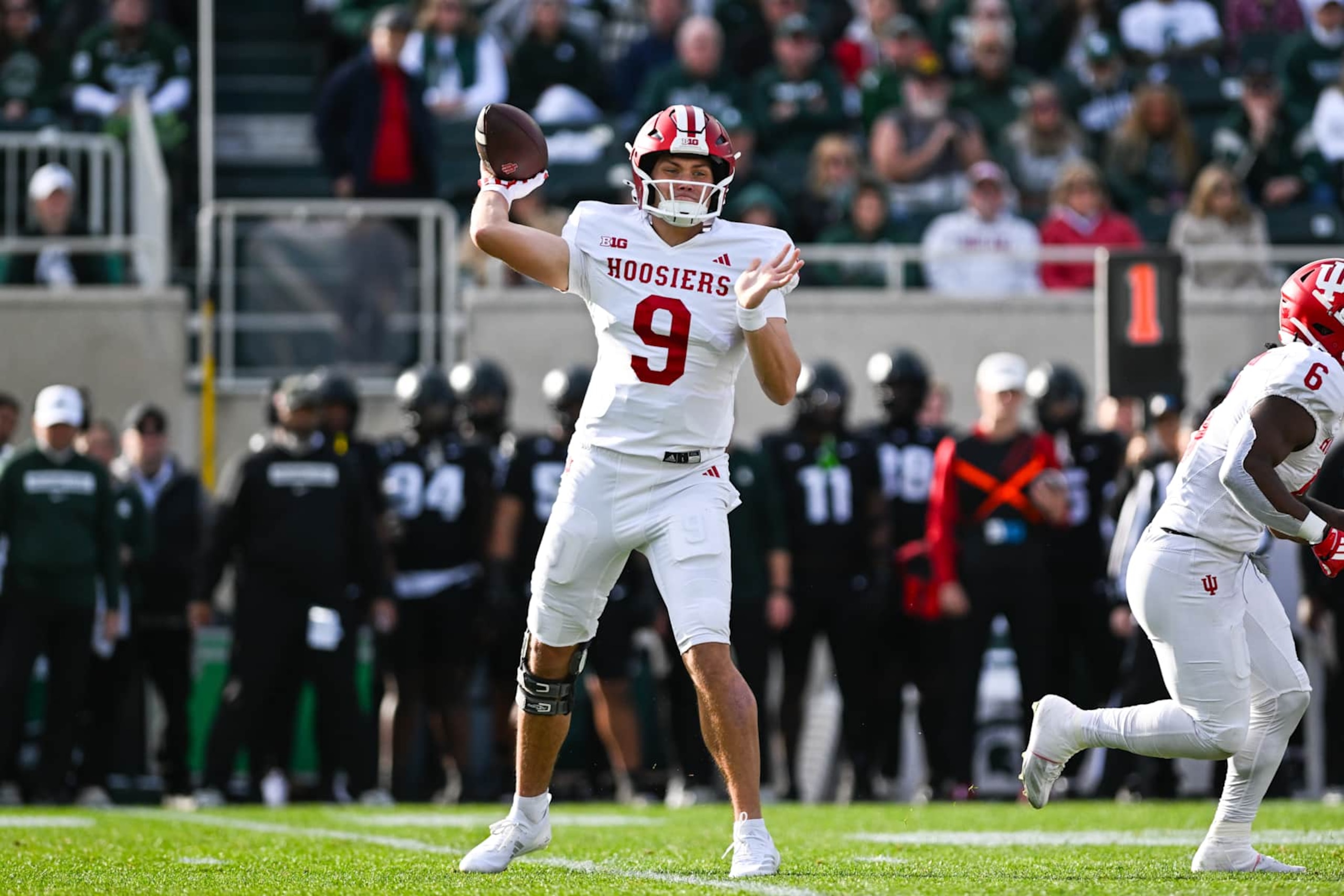 EAST LANSING, MI - NOVEMBER 02: Indiana Hoosiers quarterback Kurtis Rourke (9) steps into a throw during a college football game between the Michigan State Spartans and the Indiana Hoosiers on November 2, 2024, at Spartan Stadium in East Lansing, MI. (Photo by Adam Ruff/Icon Sportswire via Getty Images) EAST LANSING, MI - NOVEMBER 02: Indiana Hoosiers quarterback Kurtis Rourke (9) steps into a throw during a college football game between the Michigan State Spartans and the Indiana Hoosiers on November 2, 2024, at Spartan Stadium in East Lansing, MI. (Photo by Adam Ruff/Icon Sportswire via Getty Images)