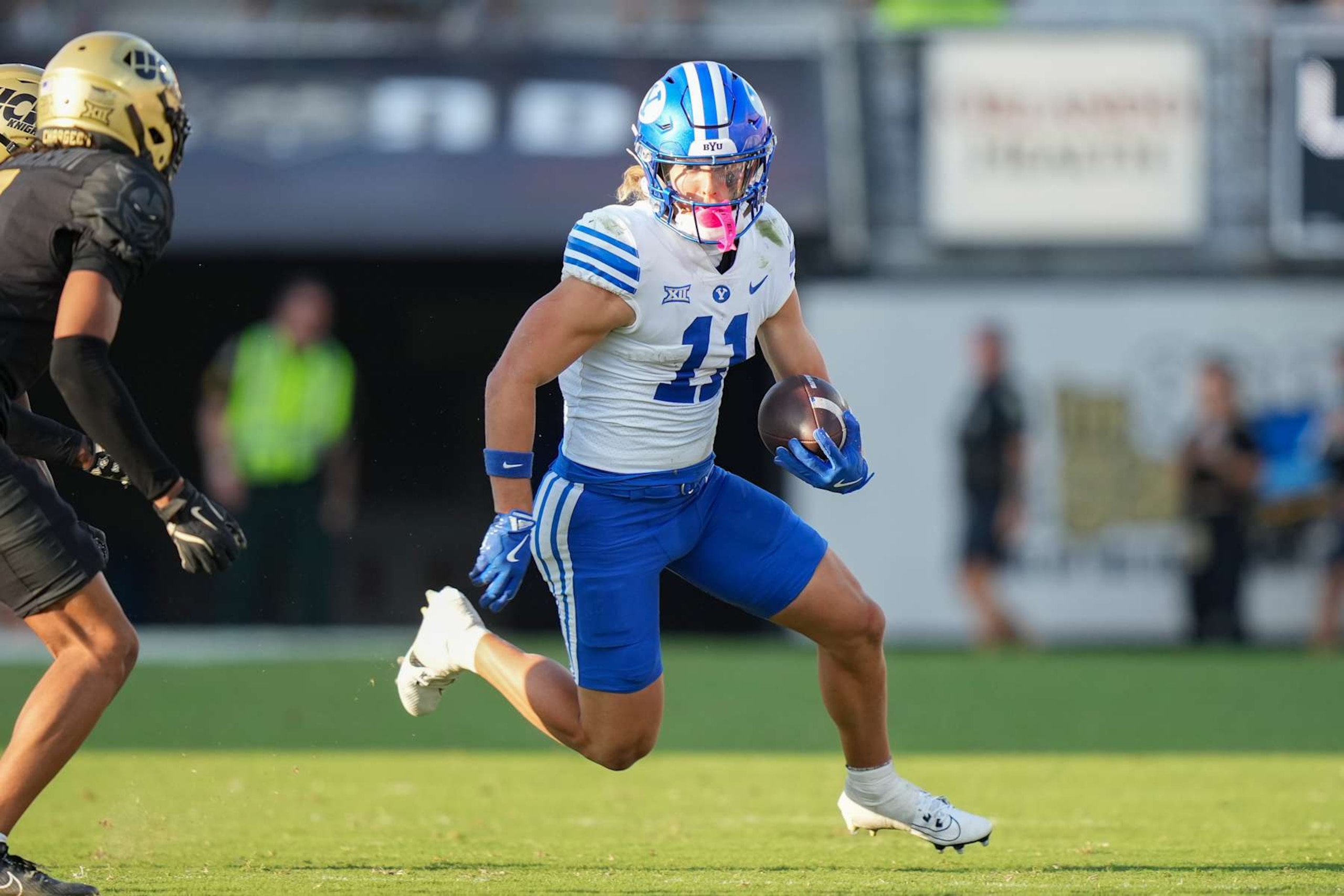 ORLANDO, FL - OCTOBER 26: Brigham Young Cougars wide receiver Parker Kingston (11) runs after a catchl during the game between the BYU Cougars and the UCF Knights on Saturday, October 26, 2024 at FBC Mortgage Stadium in Orlando, Fla. (Photo by Peter Joneleit/Icon Sportswire via Getty Images) ORLANDO, FL - OCTOBER 26: Brigham Young Cougars wide receiver Parker Kingston (11) runs after a catchl during the game between the BYU Cougars and the UCF Knights on Saturday, October 26, 2024 at FBC Mortgage Stadium in Orlando, Fla. (Photo by Peter Joneleit/Icon Sportswire via Getty Images)