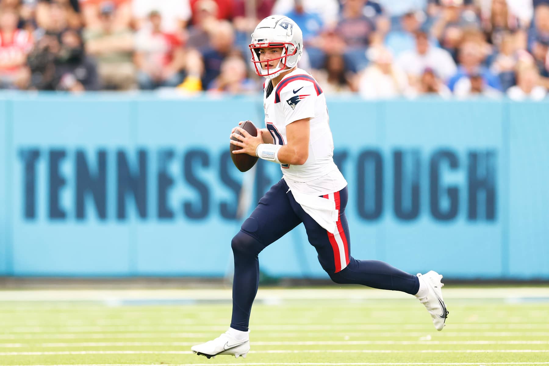 NASHVILLE, TENNESSEE - NOVEMBER 03: Drake Maye #10 of the New England Patriots runs with the ball during the first half of the game between the Tennessee Titans and the New England Patriots at Nissan Stadium on November 03, 2024 in Nashville, Tennessee. (Photo by Johnnie Izquierdo/Getty Images) NASHVILLE, TENNESSEE - NOVEMBER 03: Drake Maye #10 of the New England Patriots runs with the ball during the first half of the game between the Tennessee Titans and the New England Patriots at Nissan Stadium on November 03, 2024 in Nashville, Tennessee. (Photo by Johnnie Izquierdo/Getty Images)