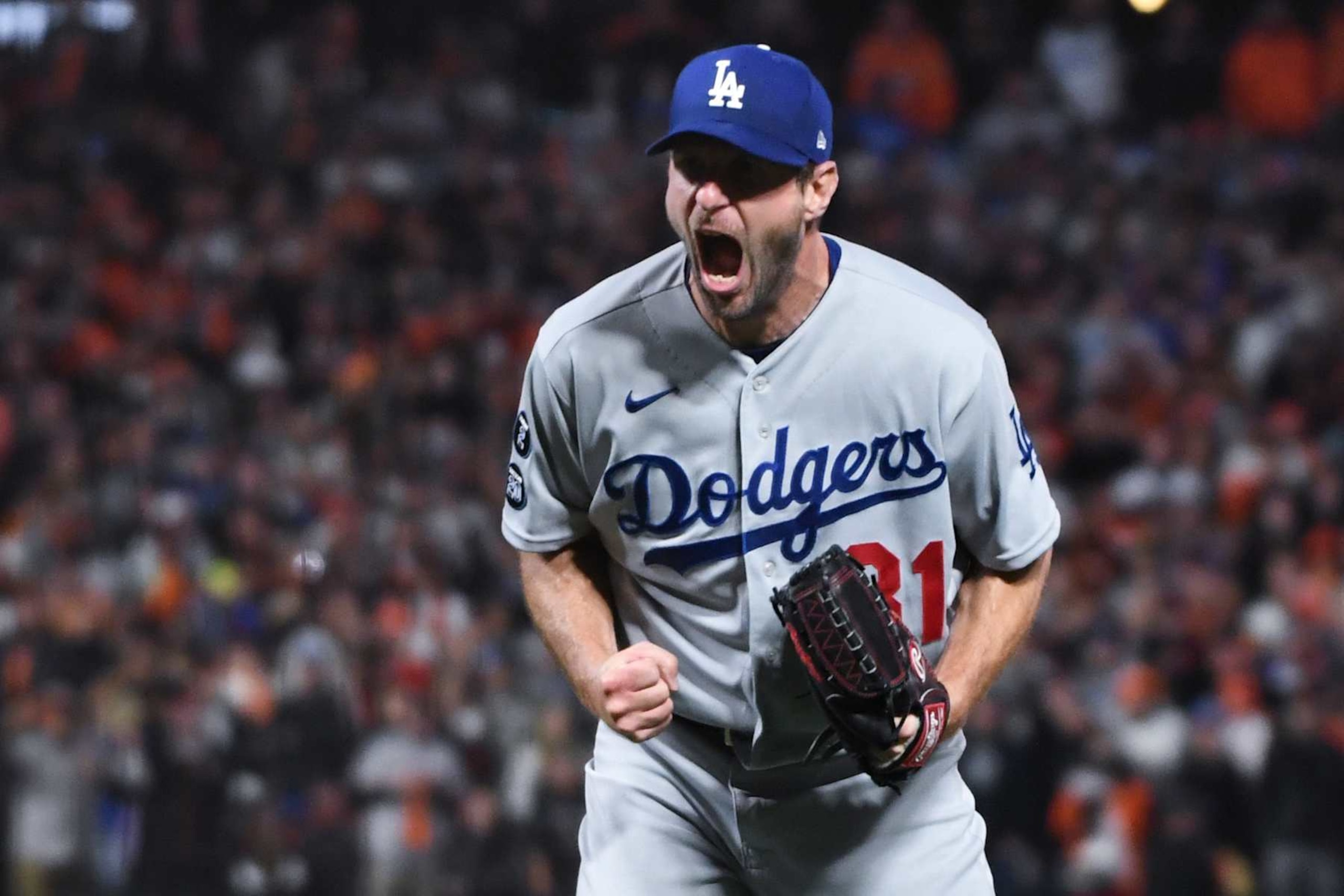 San Francisco, CA - October 14: Los Angeles Dodgers starting pitcher Max Scherzer reacts after striking out San Francisco Giants' Wilmer Flores to end game five of the 2021 National League Division Series at Oracle Park on Thursday, Oct. 14, 2021 in San Francisco, CA. The Dodgers won 2-1. (Wally Skalij / Los Angeles Times via Getty Images) San Francisco, CA - October 14: Los Angeles Dodgers starting pitcher Max Scherzer reacts after striking out San Francisco Giants' Wilmer Flores to end game five of the 2021 National League Division Series at Oracle Park on Thursday, Oct. 14, 2021 in San Francisco, CA. The Dodgers won 2-1. (Wally Skalij / Los Angeles Times via Getty Images)