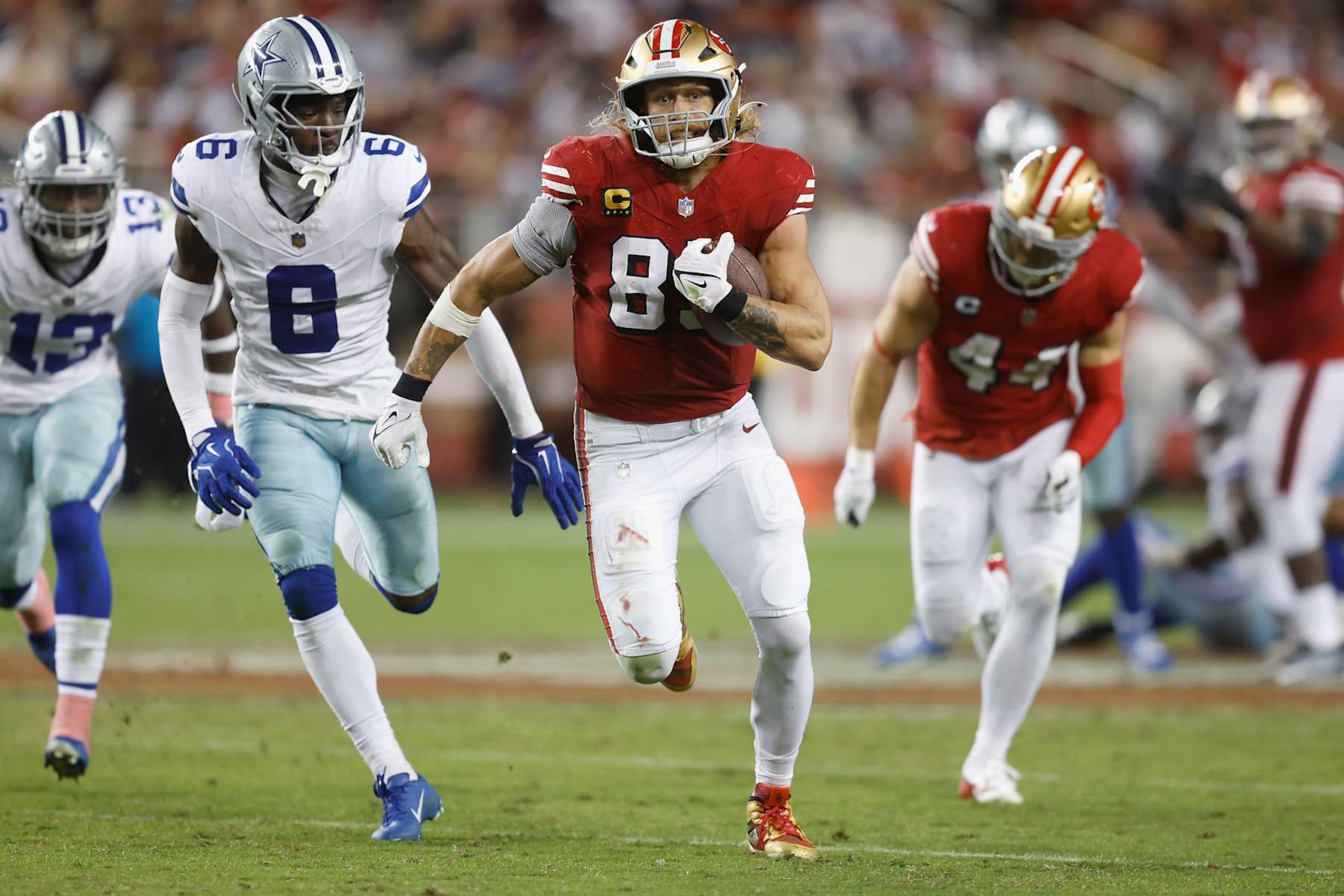 SANTA CLARA, CALIFORNIA - OCTOBER 27: George Kittle #85 of the San Francisco 49ers runs with the ball after a catch in the third quarter against the Dallas Cowboys at Levi's Stadium on October 27, 2024 in Santa Clara, California. (Photo by Lachlan Cunningham/Getty Images)