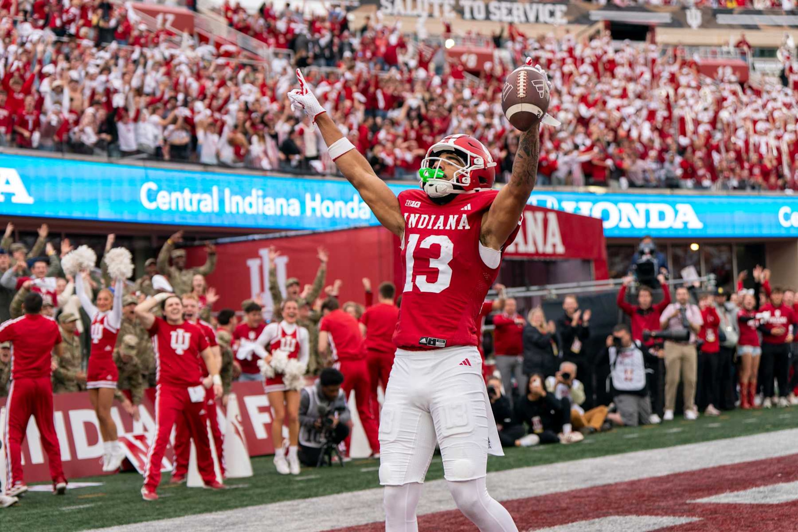 BLOOMINGTON, IN - NOVEMBER 09: Elijah Sarratt #13 of the Indiana Hoosiers celebrates after scoring a touchdown during a college football game between the Indiana Hoosiers and the Michigan Wolverines at Memorial Stadium on November 09, 2024 in Bloomington, IN.